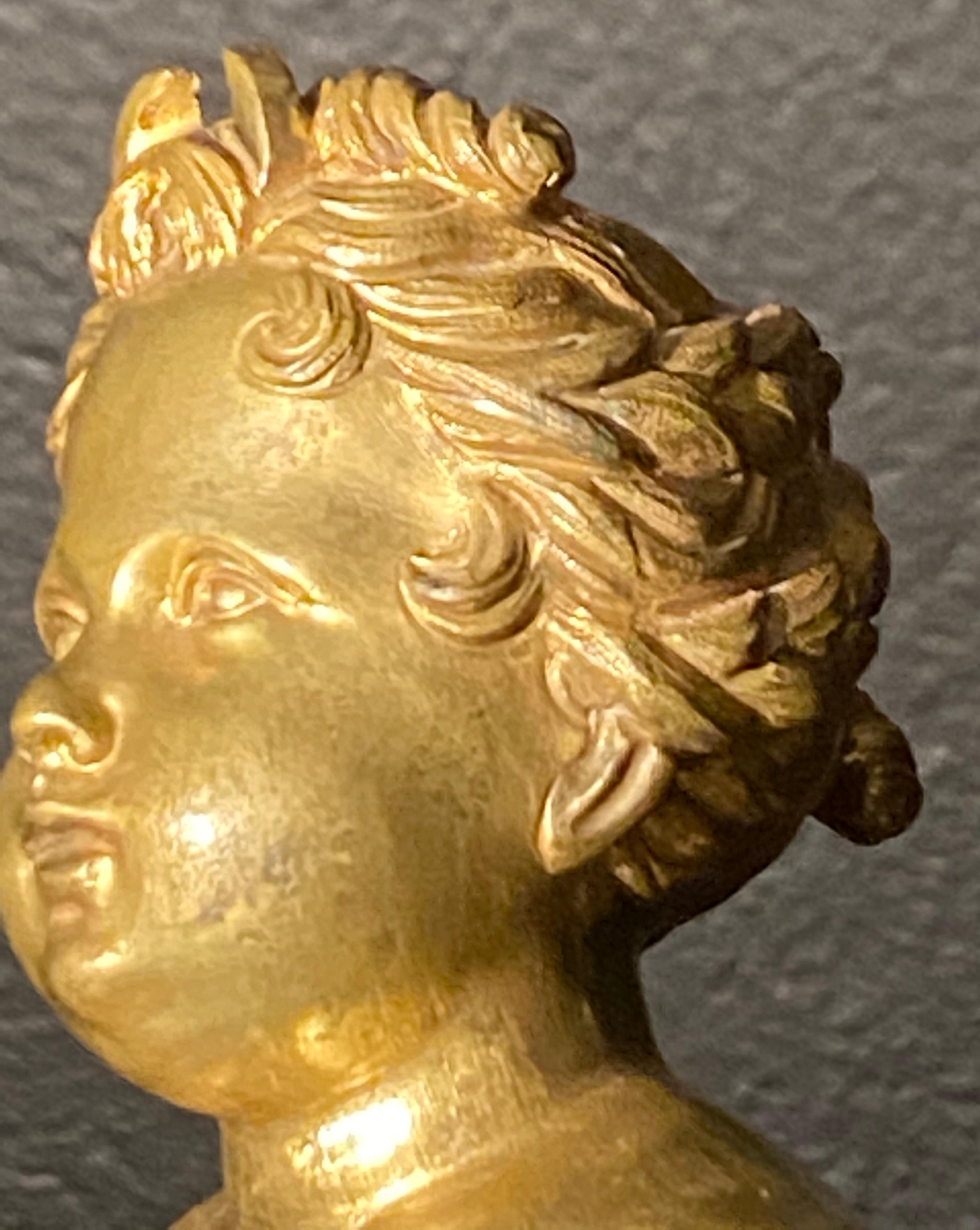 Metal 19th Century French Andirons, Opposing Cherubs on Stands in Doré Bronze