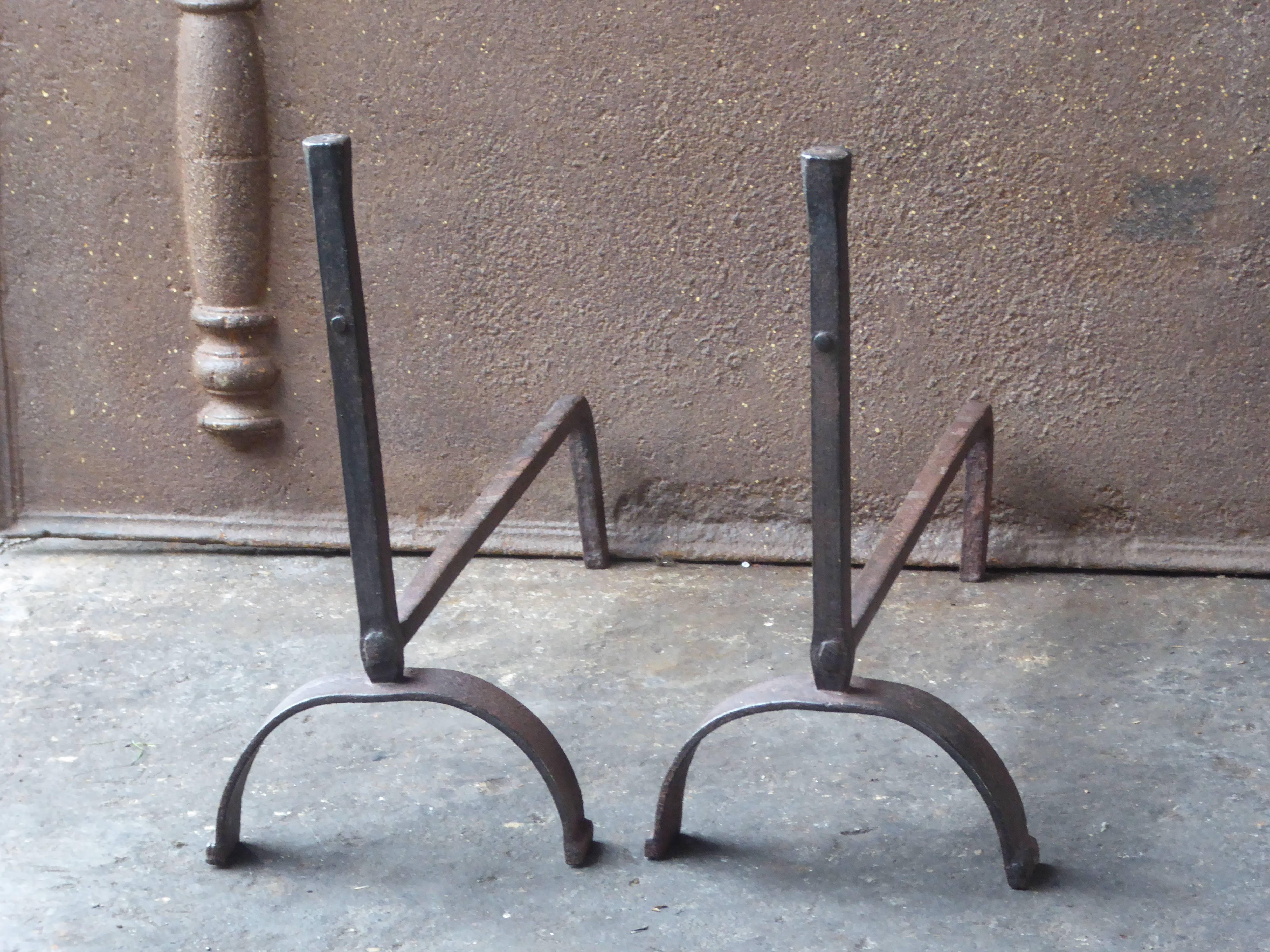 19th century French andirons made of wrought iron.

We have a unique and specialized collection of antique and used fireplace accessories consisting of more than 1000 listings at 1stdibs. Amongst others, we always have 500+ firebacks, 400+ pairs of