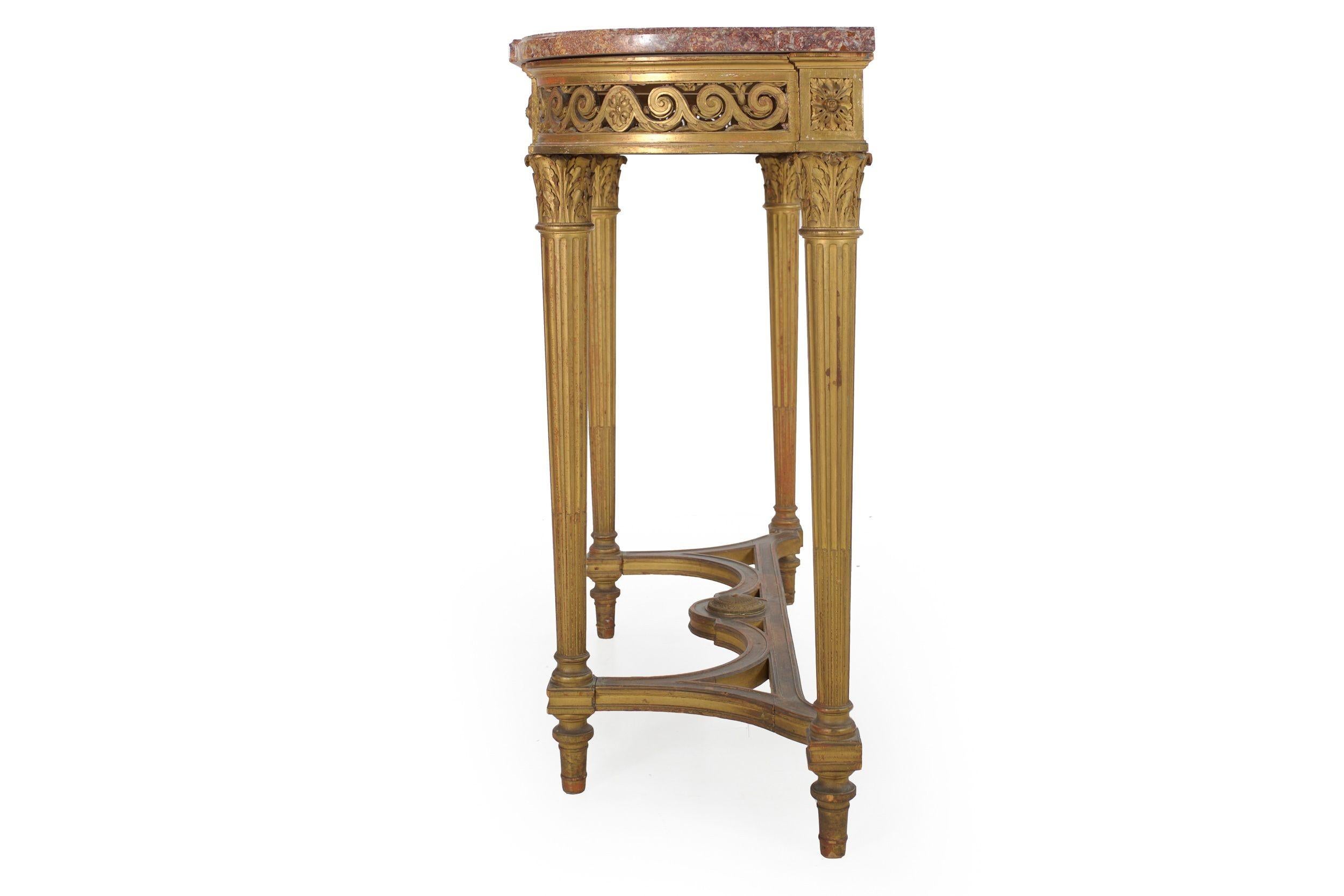 LOUIS XVI STYLE CARVED GILTWOOD PIER TABLE
Circa last quarter of the 19th century
Item # 203HQB04P 

A very good 19th century pier table with a conforming wonderful red and yellow marble top, it features a pierced apron with repeating cresting waves