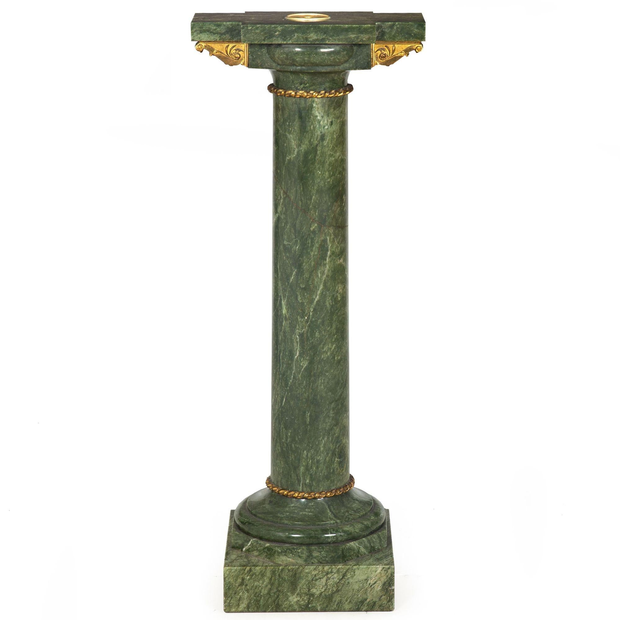FRENCH NEOCLASSICAL GREEN MARBLE GILT-METAL MOUNTED PEDESTAL

Circa late 19th century, with inset rotation point for sculpture with a pintle

39 5/8
