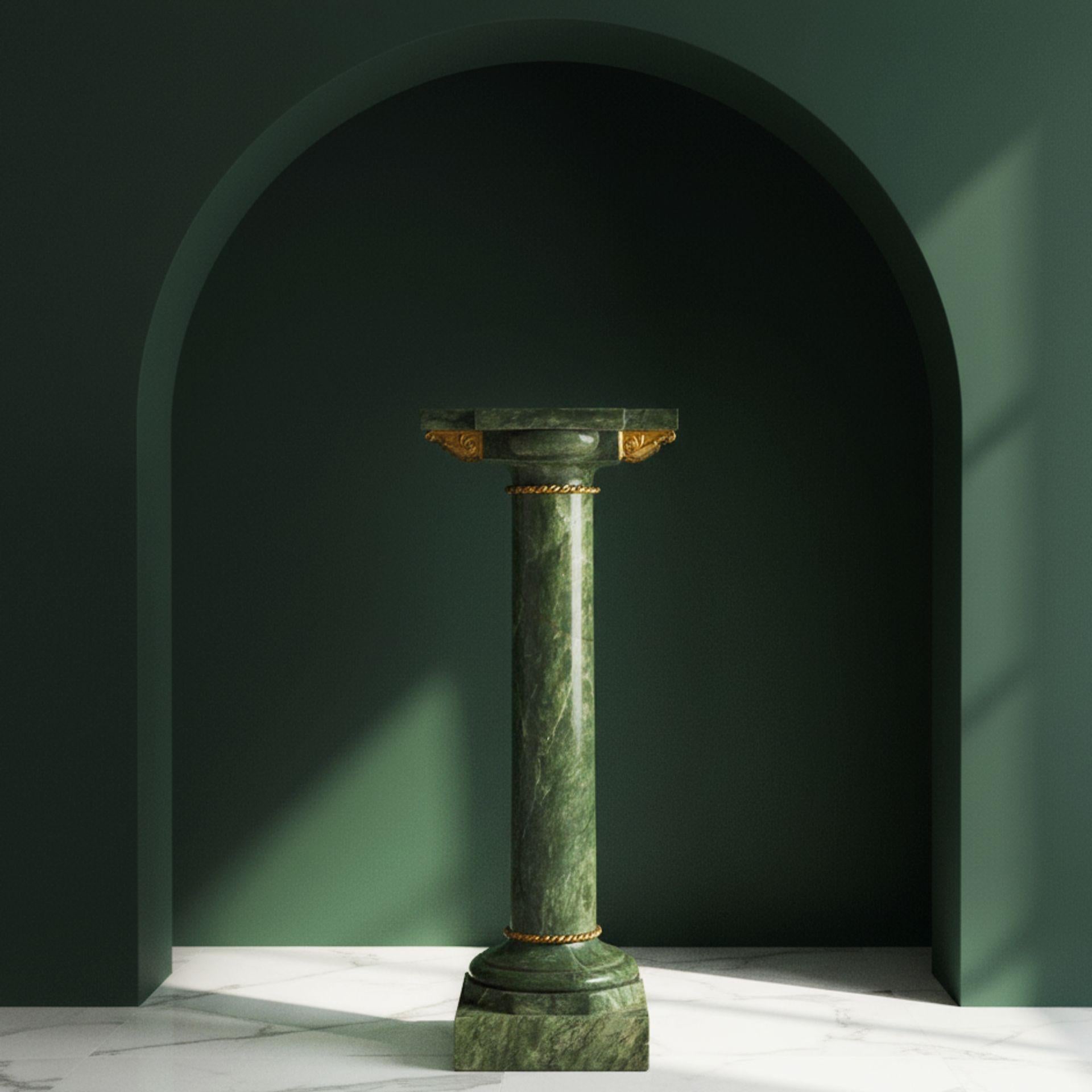 FRENCH NEOCLASSICAL GREEN MARBLE GILT-METAL MOUNTED PEDESTAL

Circa late 19th century, with inset rotation point for sculpture with a pintle

39 5/8
