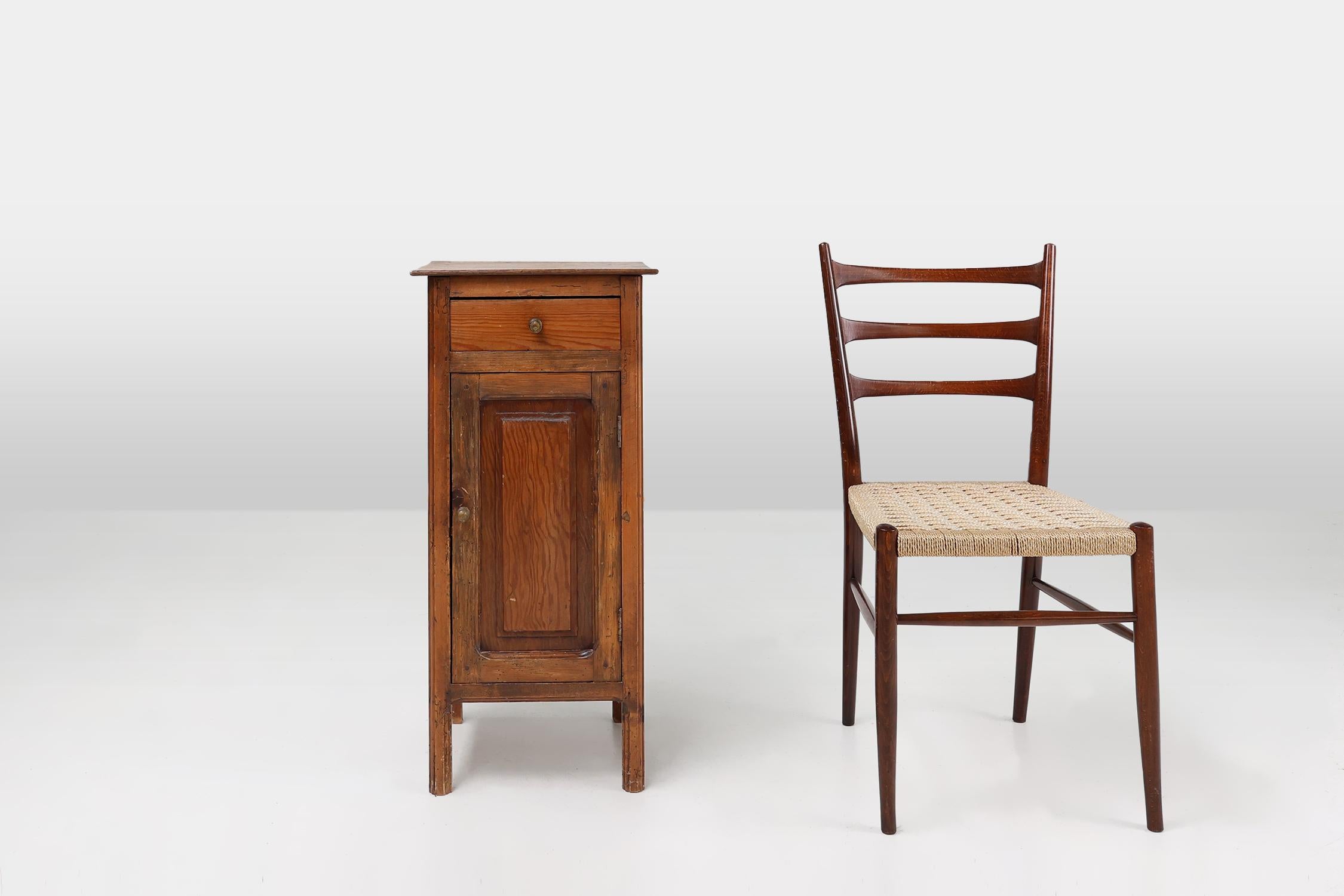 France / 1850 / nightstand / pine wood / Rustic / Mid-century 

This beautiful nightstand was handcrafted in France around 1850. The small cabinet features a good quality solid pine wood construction, with beautiful deep antique wood tone. Under the