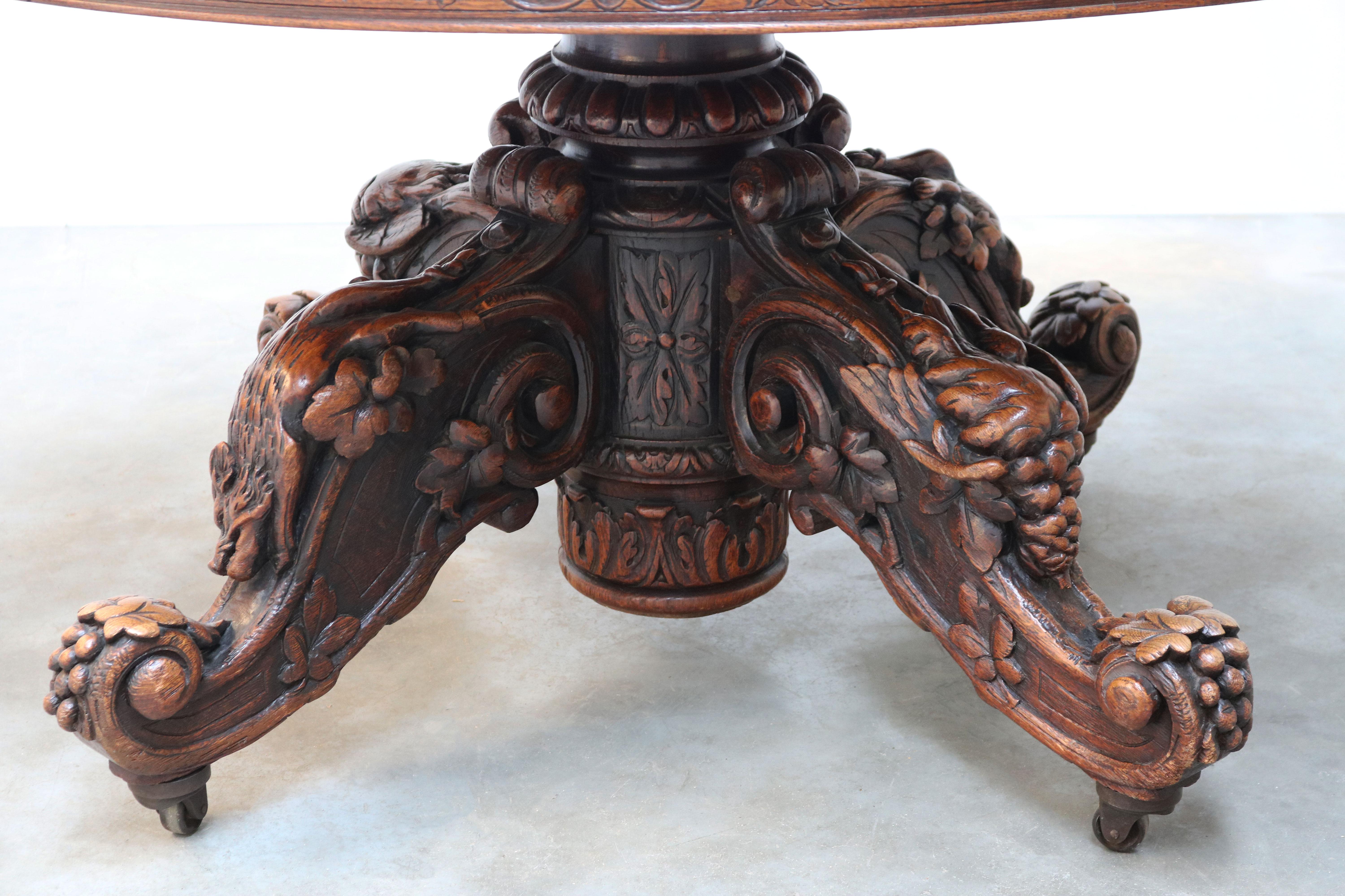 Exquisite 19th century French antique hunting table / beast table in black forest style, large oval model. 
Amazing Trophy model with 4 different hunting trophies displayed on the tables legs. 
Made from European oak with superb craftsmanship, the