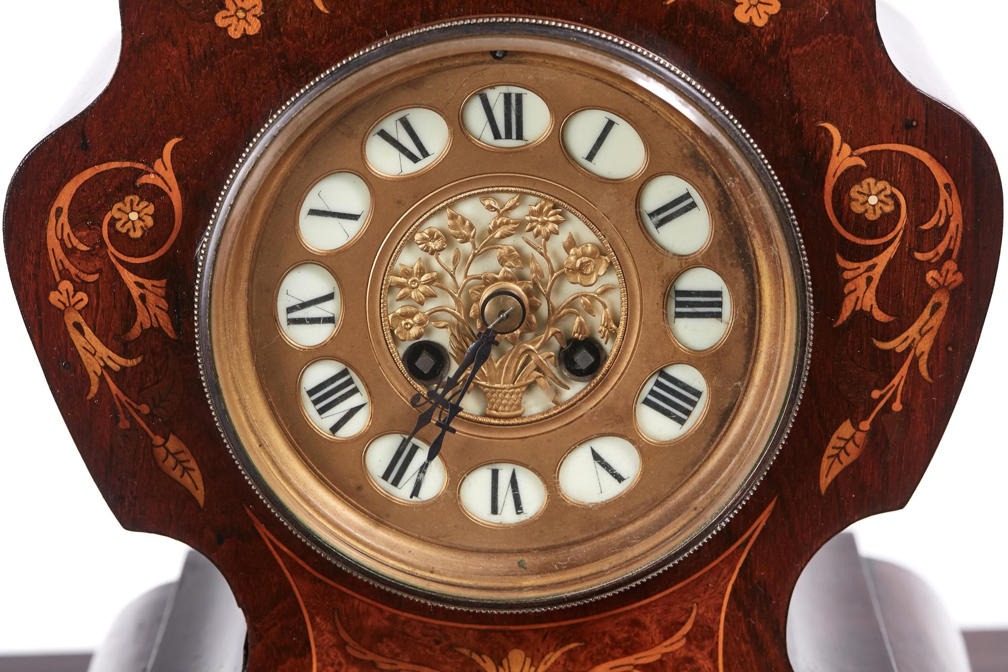 This is a 19th century French antique rosewood marquetry inlaid 8 day mantel clock with a lovely shaped marquetry inlaid case 8 day movement with a roman numeral dial.

    