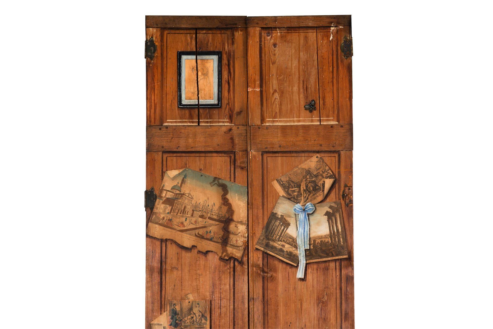PAIR OF FRENCH SCRUBBED AND WORN PINE TENON-MORTISED DOORS
With decoupage & trompe l'oeil decoration throughout  19th century
Item # 306UMJ21P 

These super fun and incredibly worn French scrubbed pine doors are austere in construction with full