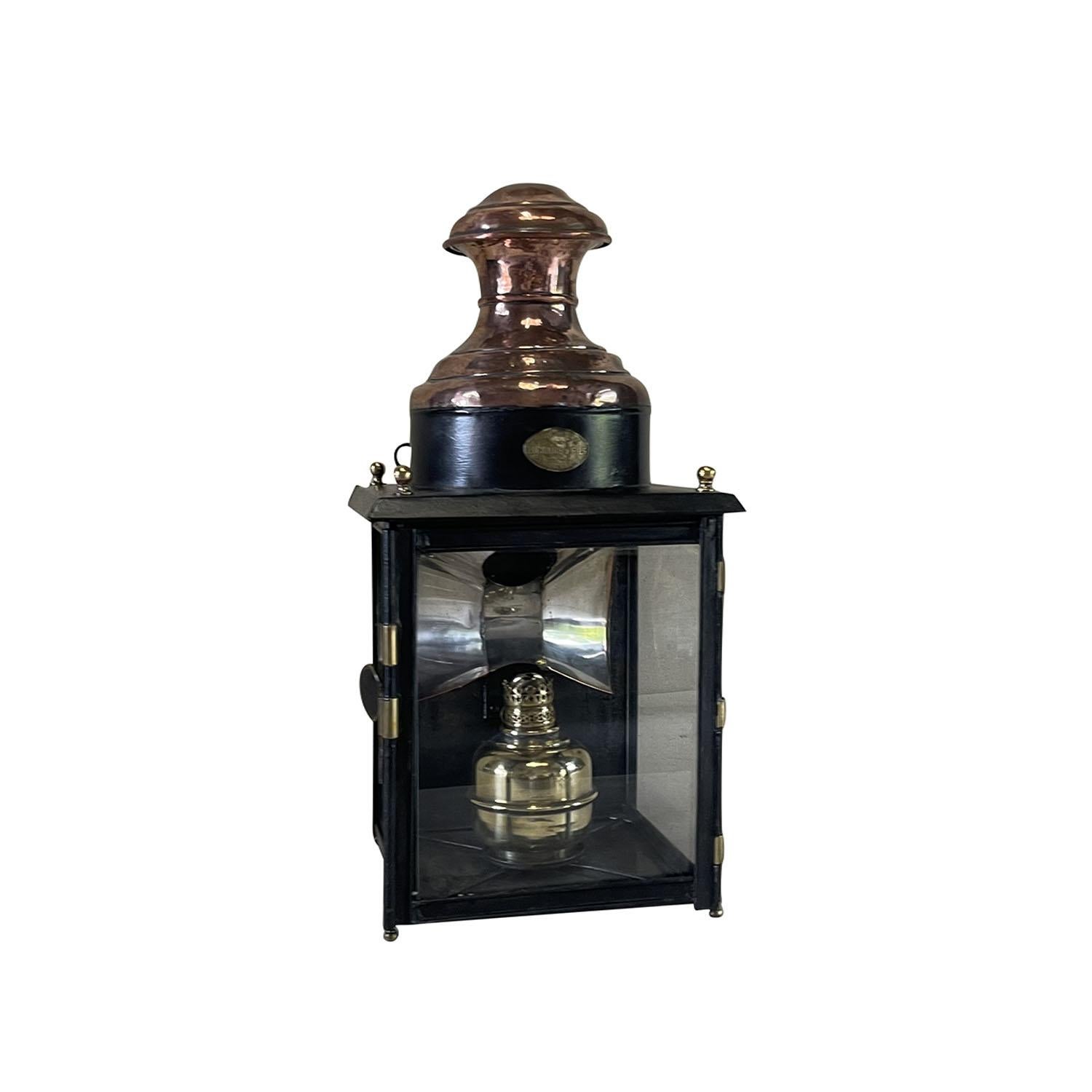 A stately antique French copper gas light lantern with a copper top, brass details, brass burner and painted in black, in good condition. The brass plate reads: Appareils D’ Eclairage, Luchaire & Fils 27, Rue Erard, Paris. This company started in