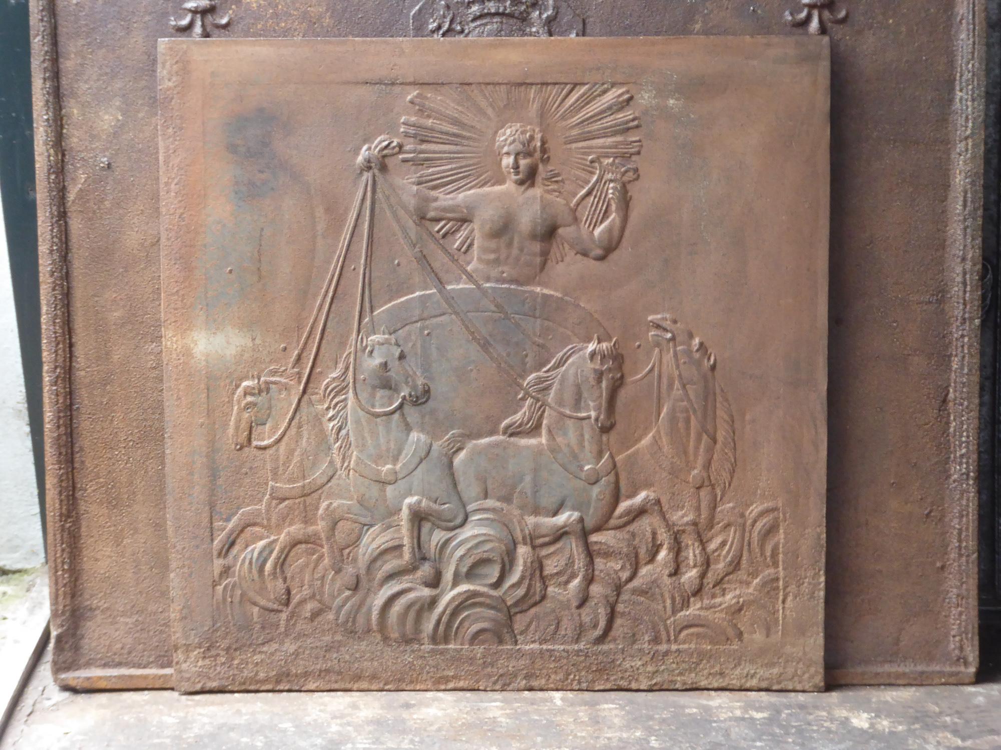 19th century French fireback with the god Apollo driving horses and a carriage. God of light, sun, truth, prophecy, music, joy and horses. Also the saving God, both in emergency caused by an epidemic or an invasion of enemies, as in any other