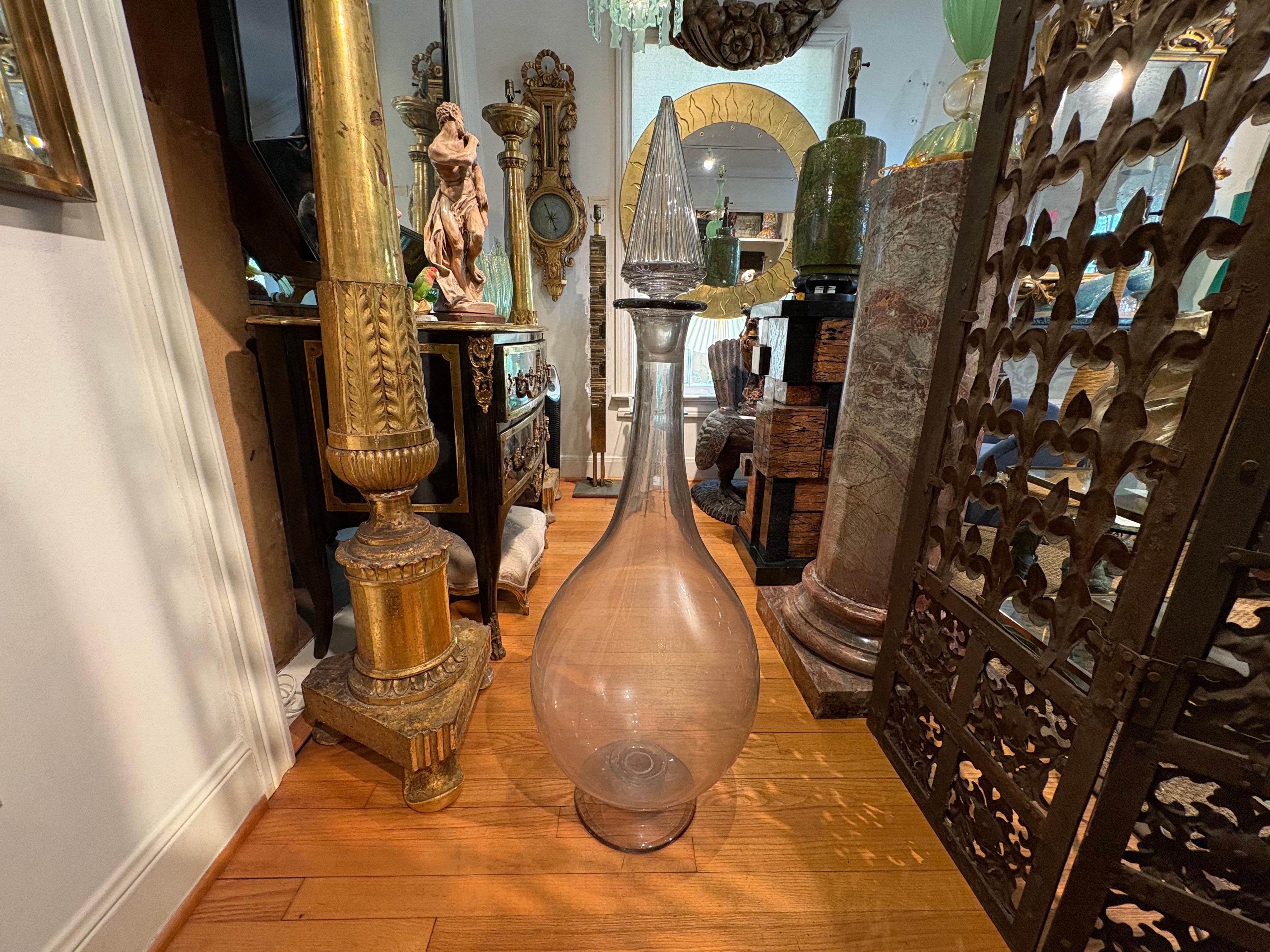 19th Century French Apothocary Bottle
Offered is a rare extra large antique French Flacon de Parfum (French Perfume Display Bottle) or also known as an apothecary bottle, pharmacy vessel or carboy.
This beautifully blown glass vessel comes with the