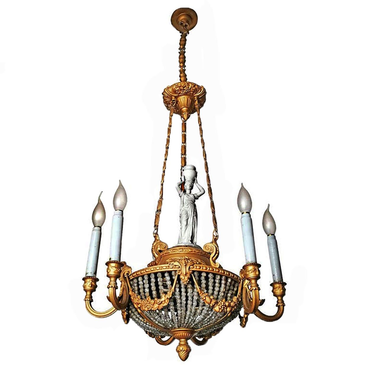 A wonderful gilt bronze and a beaded crystal basket, 8-light ceiling fixture decorated with fine ornaments and garlands, France, late 19th century. Porcelain caryatid and opaline white glass candles.
Measures:
Diameter 21.7 in/ 55 cm
Height 53.2 in