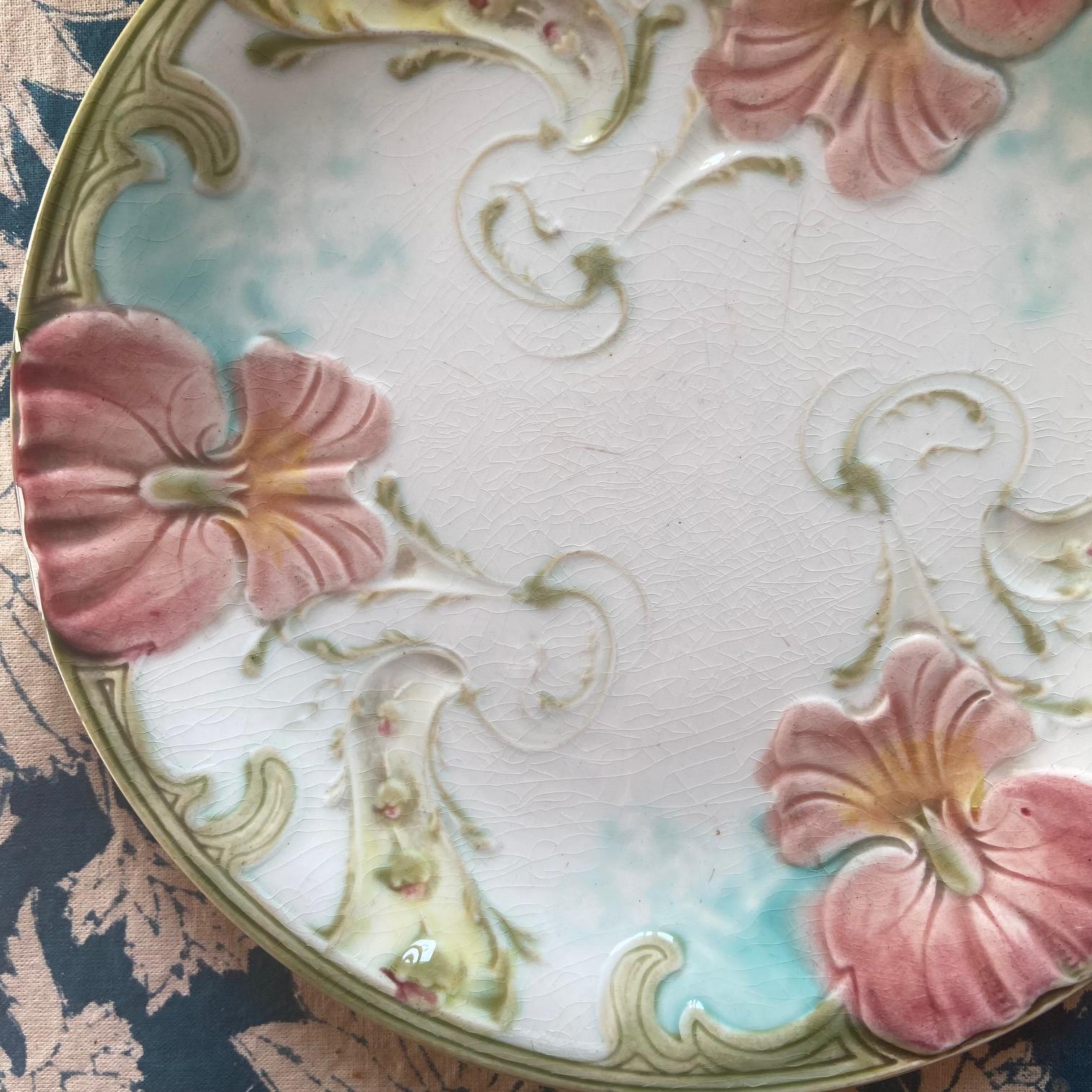This is a beautiful, poetic and rare Majolica plate.
The colors and pattern are tender and luminous.

In the tradition of the Art Nouveau Majolica plates, this will be a great find for a collector.

Varnish is crazed, and there are a few scratches