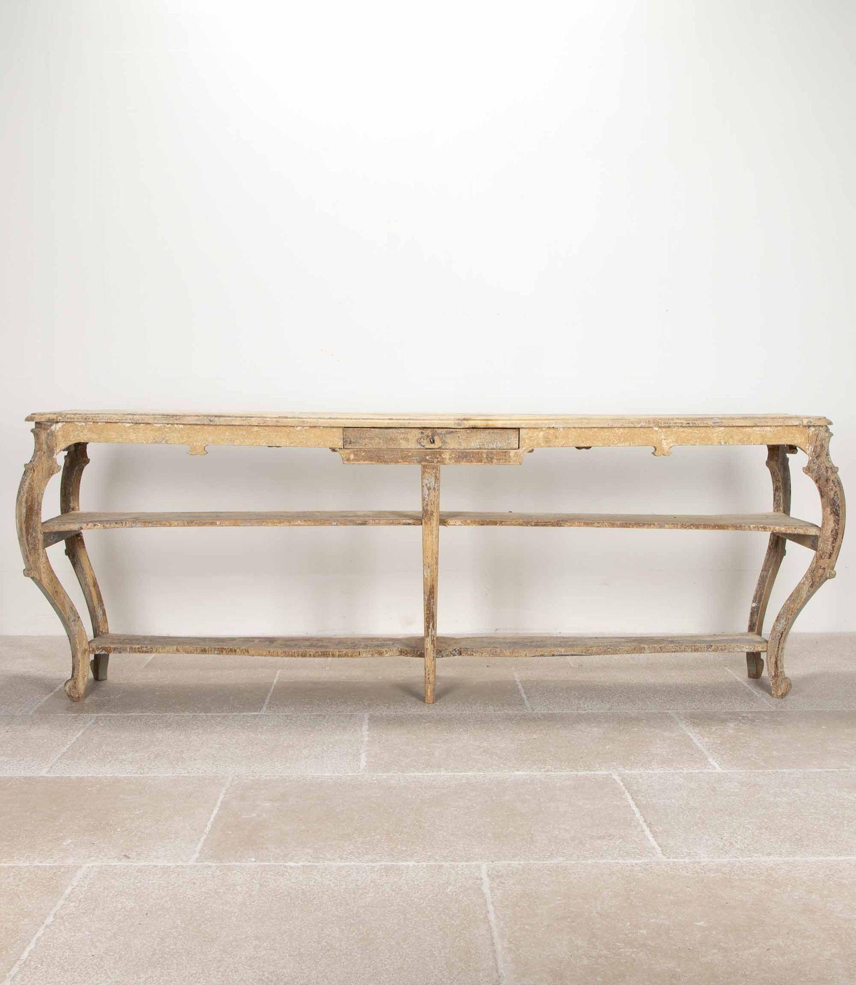 Superb 19th Century French Art Nouveau Shop display table or drapers table.
Curving Art Nouveau lines and original untouched worn painted finish. With a small centre drawer including lock and key.
Circa 1880.
