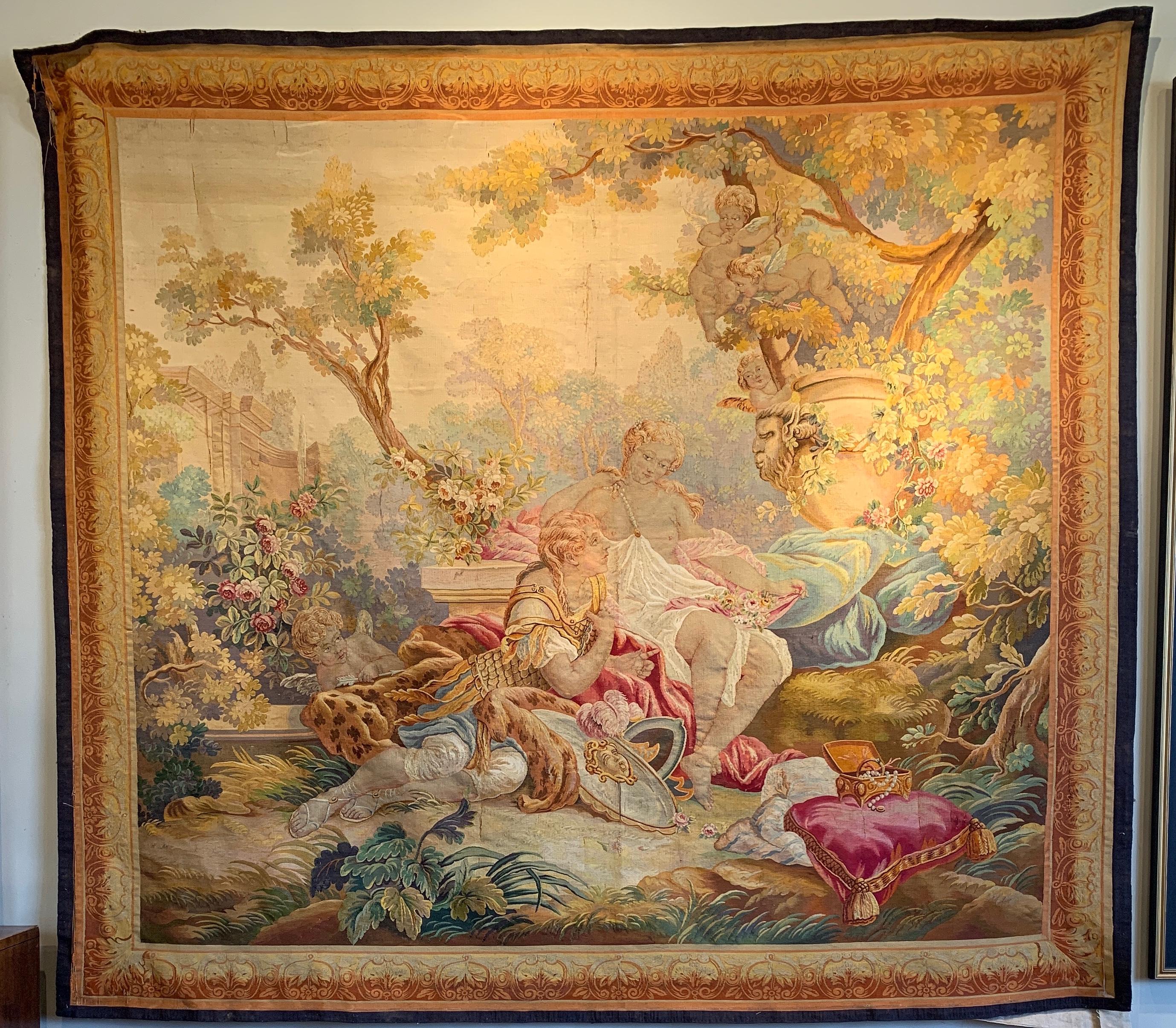 A large and exquisitely crafted French Aubusson wall tapestry woven in the mid-19th century in the opulent Rococo taste. Aubusson, renowned for its handwoven carpets, crafted fine tapestries such as this to adorn noble and royal residences. This