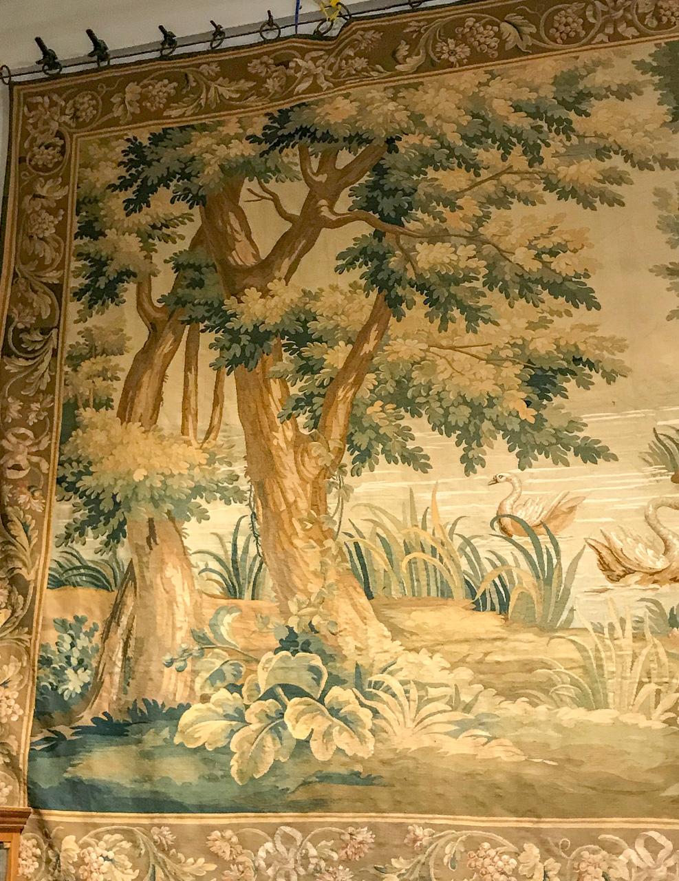 19th century French Aubusson tapestry depicting a landscape scene with flora and fauna in rich colors, and exhibiting a Classic style perfect for many types of decor. Circa 1880.