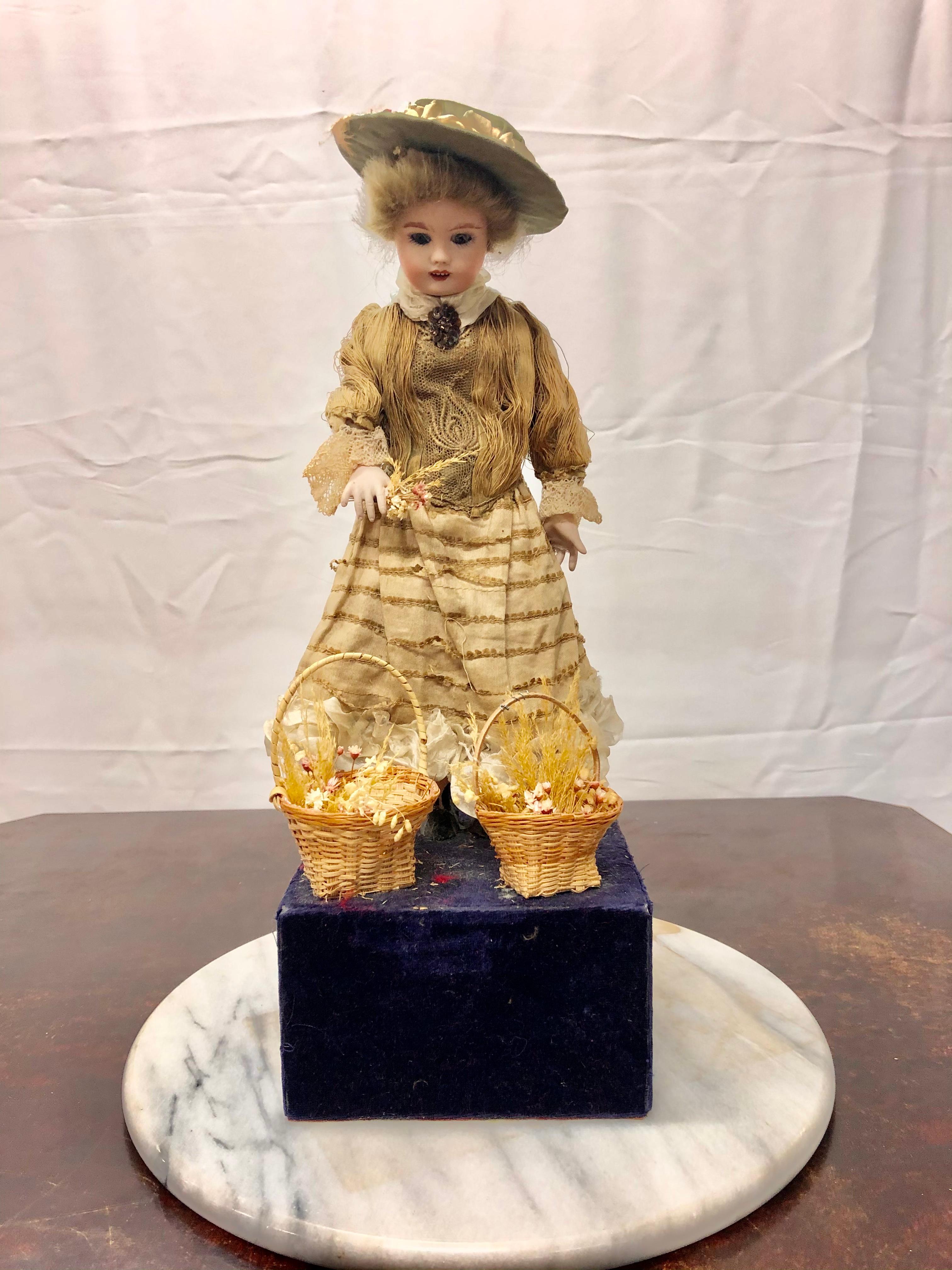 Fabulous rare 19th century automaton. Most likely made in France at the end of the 19th century. She is a real beauty and in remarkable condition for her age. She is made of porcelain and cloth. When you wind her she bends her head and raises