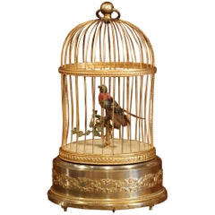 automate français du 19ème siècle - Oiseau chantant dans une cage en laiton