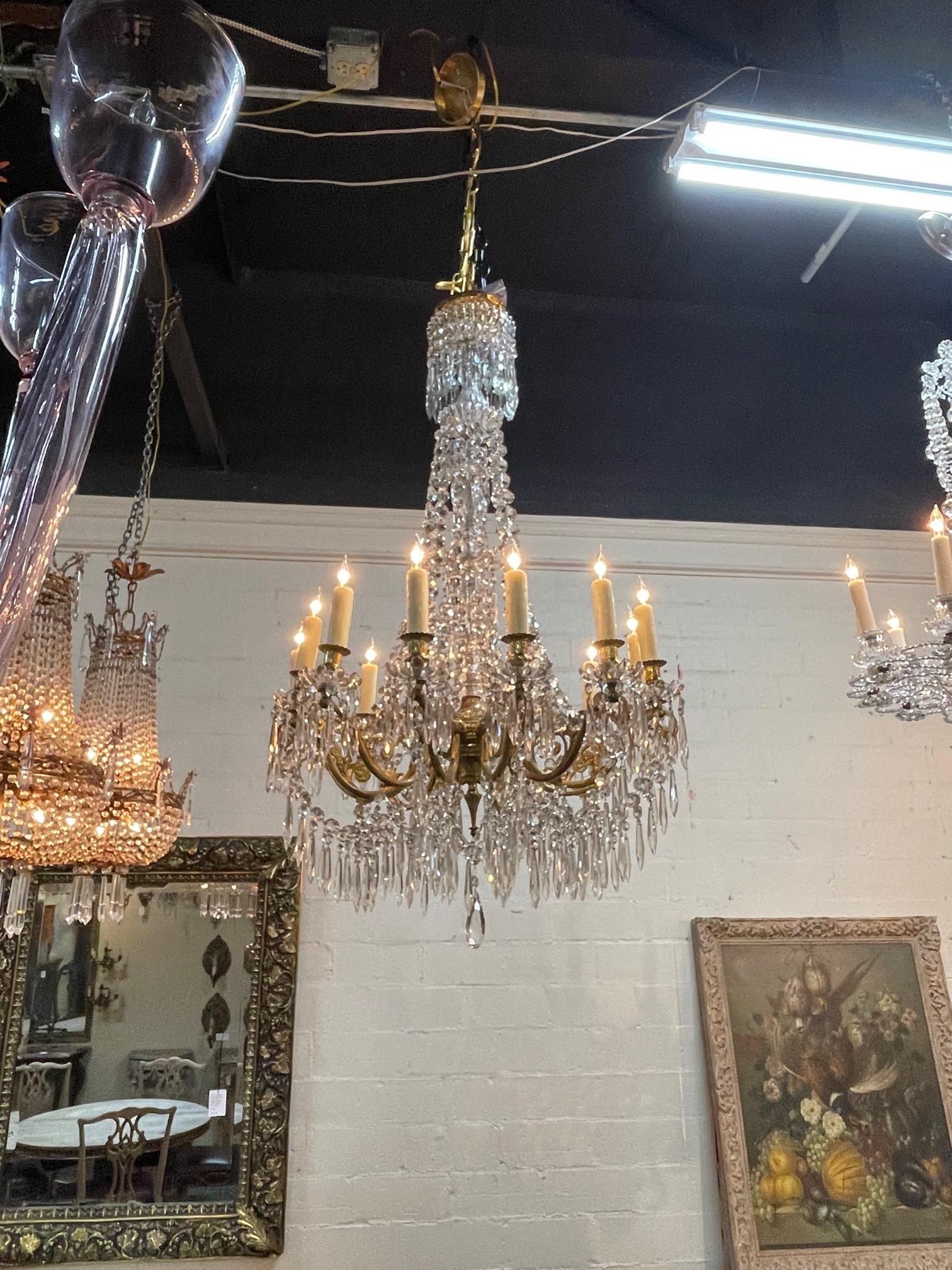 Exceptional 19th century French Baccarat crystal and gilt bronze 12 light chandelier. Beautiful scale and shape and covered in gorgeous crystals. Truly superb!!