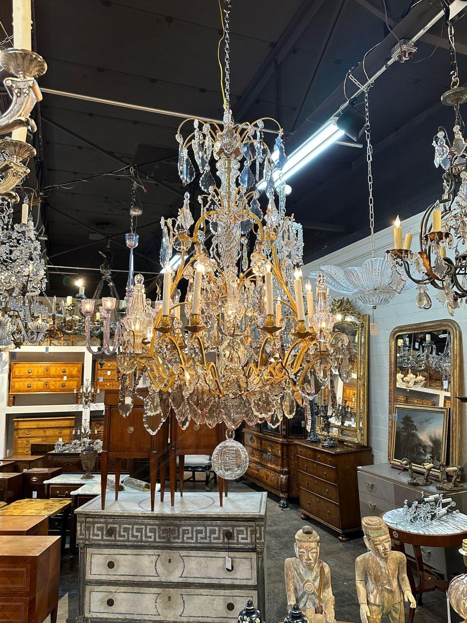 Outstanding 19th century French Baccarat gilt bronze and crystal chandelier. Circa 1870. The chandelier has been professionally rewired, comes with matching chain and canopy. It is ready to hang!