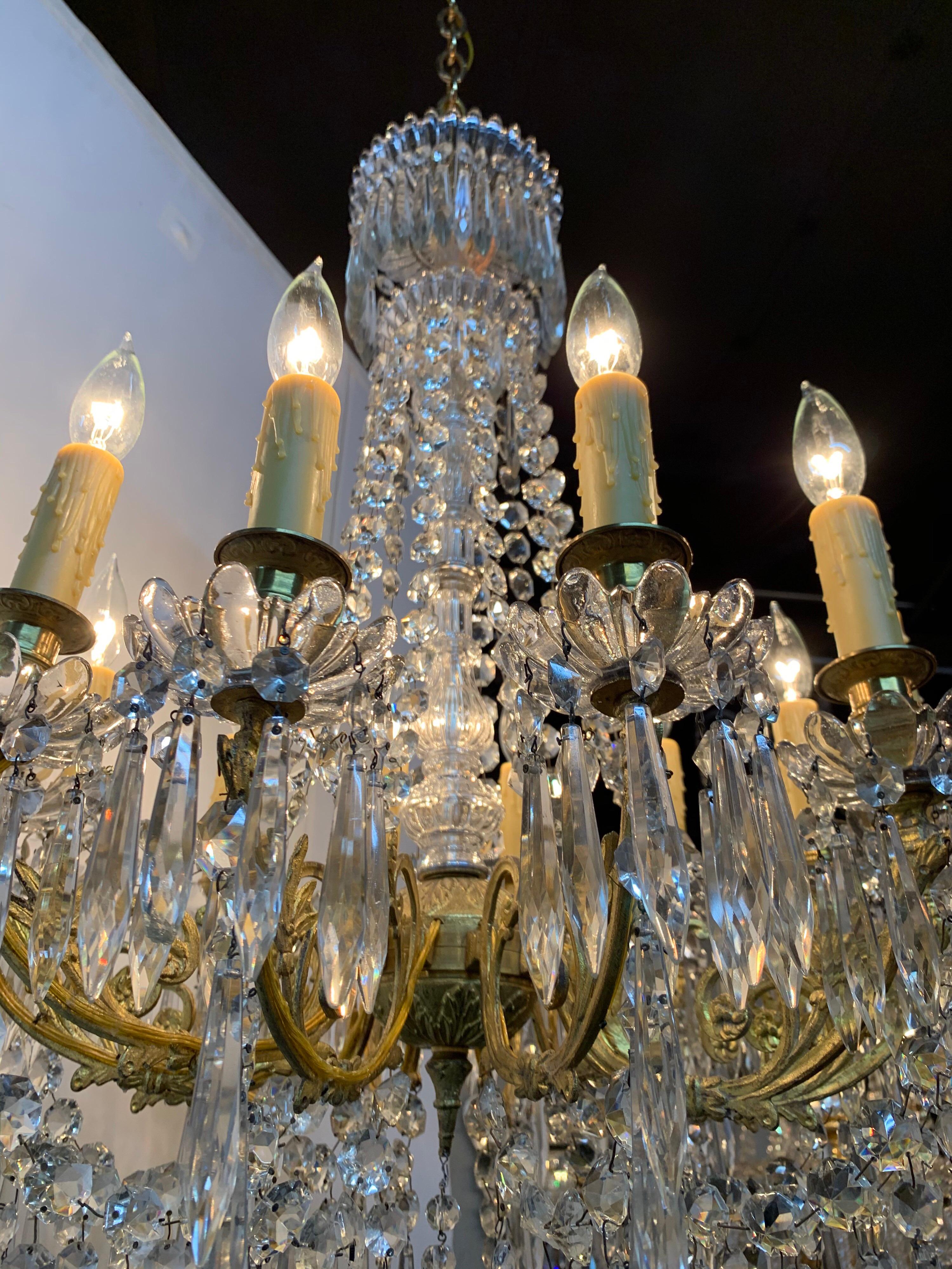 Very fine 12 light French gilt bronze chandelier dripping with gorgeous baccarat crystals. Makes a very impressive statement!
