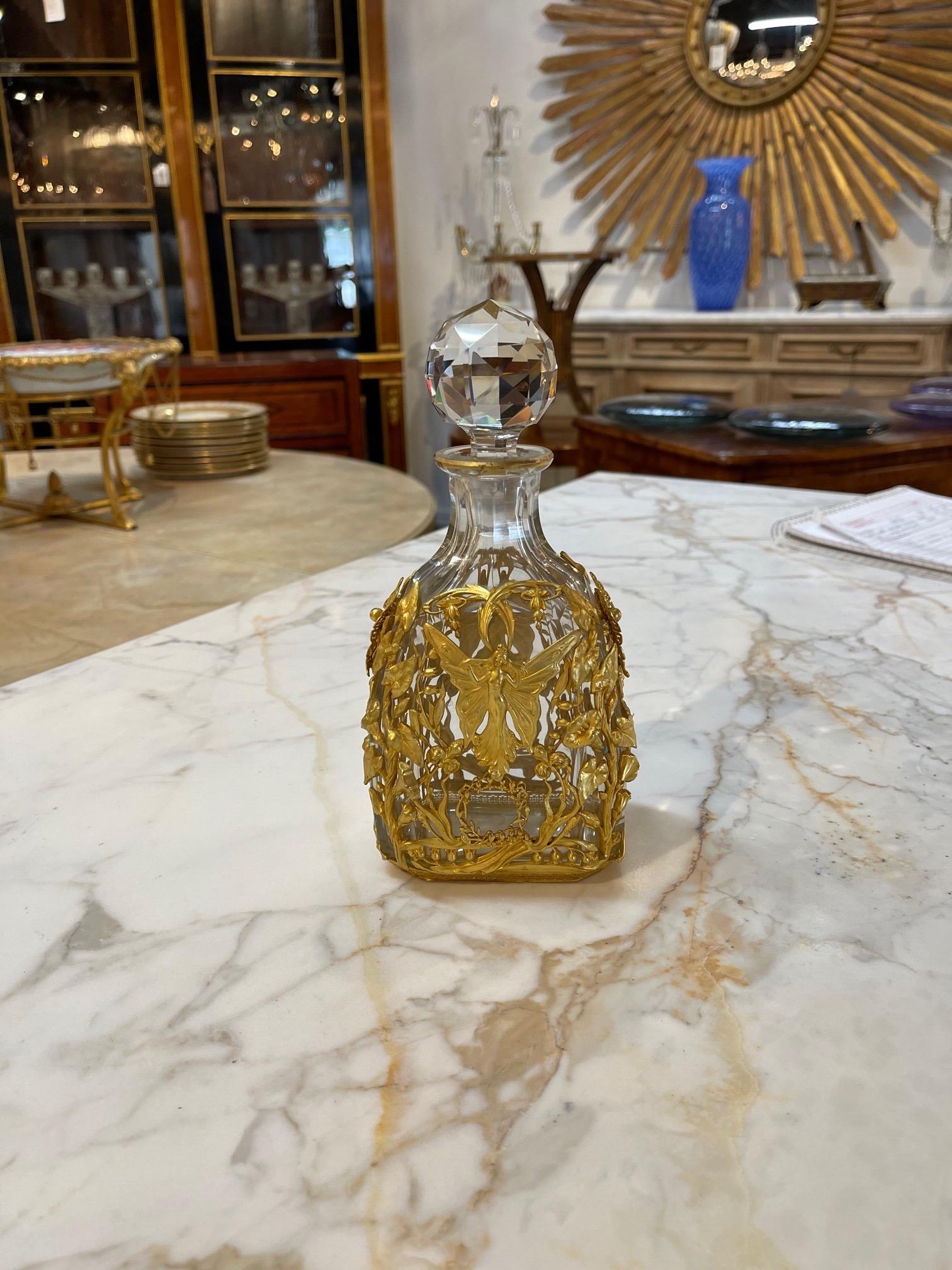 Beautiful decorative 19th century French Baccarat style bronze dore bottle. Note the image of a women as well as leaves and flowers in dore gold! So pretty!!