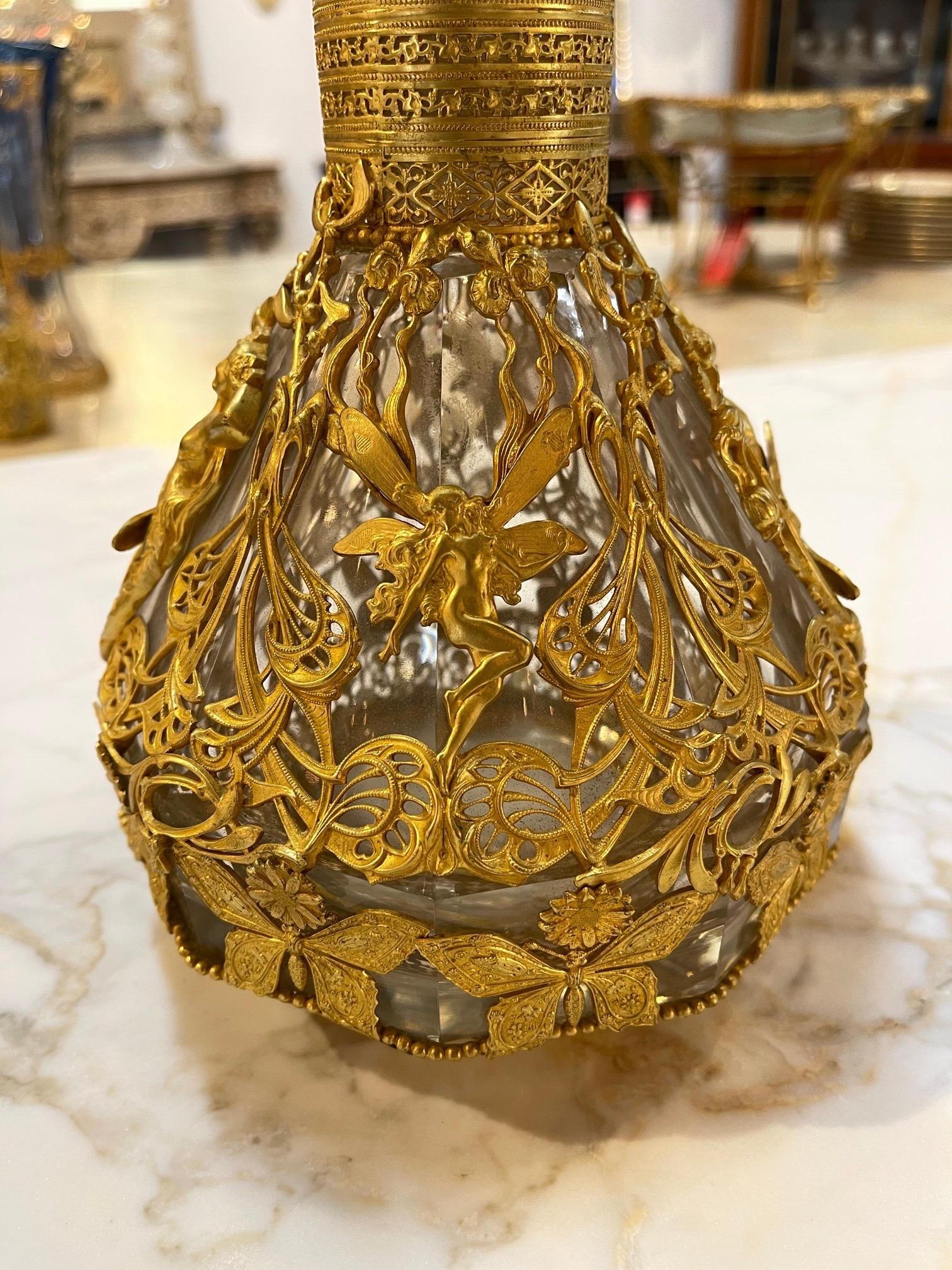 Exceptional 19th century French Baccarat style doré bottle. Beautiful images of a women, dragonfly's and butterflies. Amazing!!