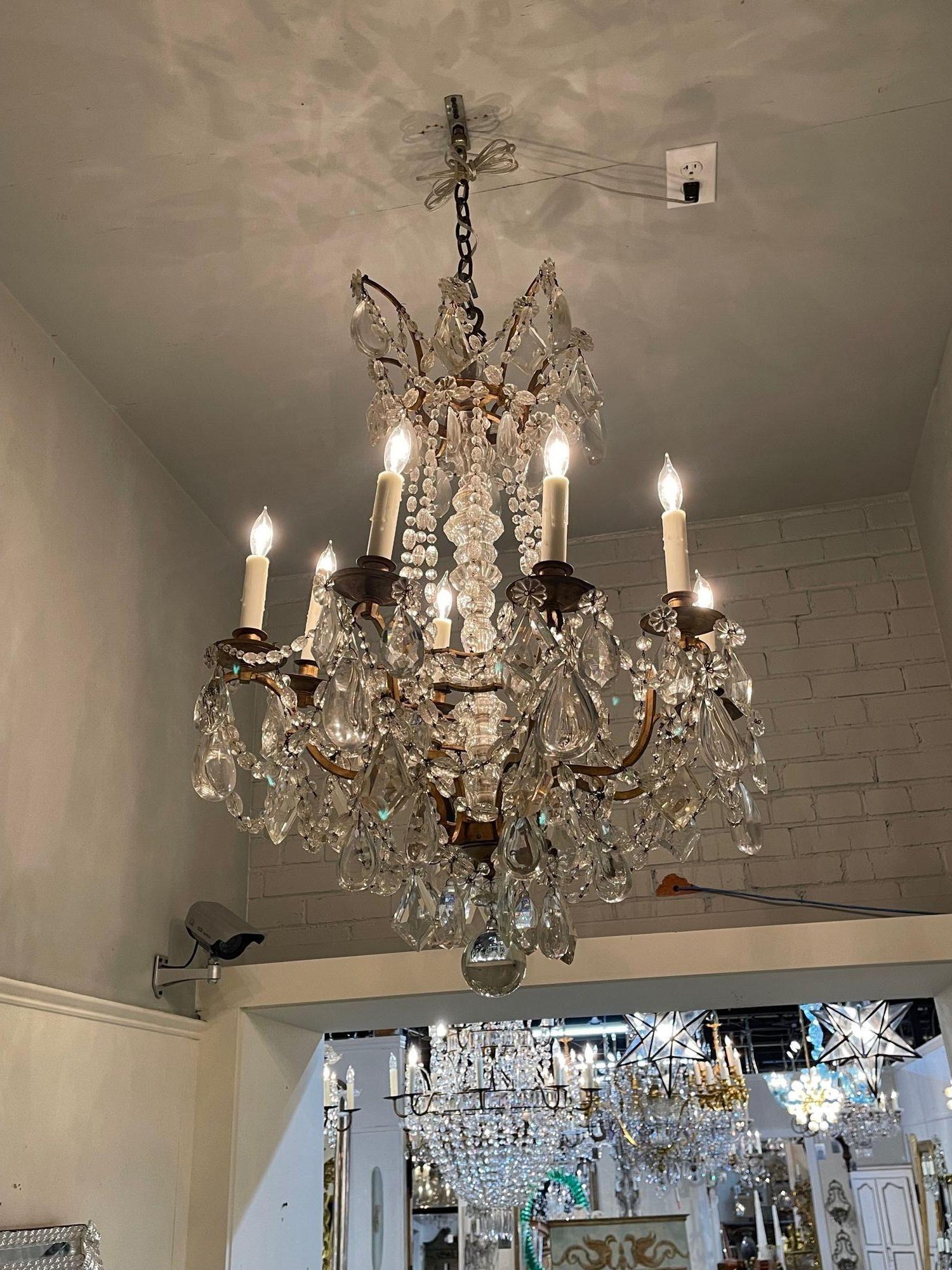 Elegant 19th century French Baccarat style gilt bronze and crystal chandelier with 8 lights. This fixture is covered in beautiful crystals and has a very fine bronze base. A lovely quality piece!