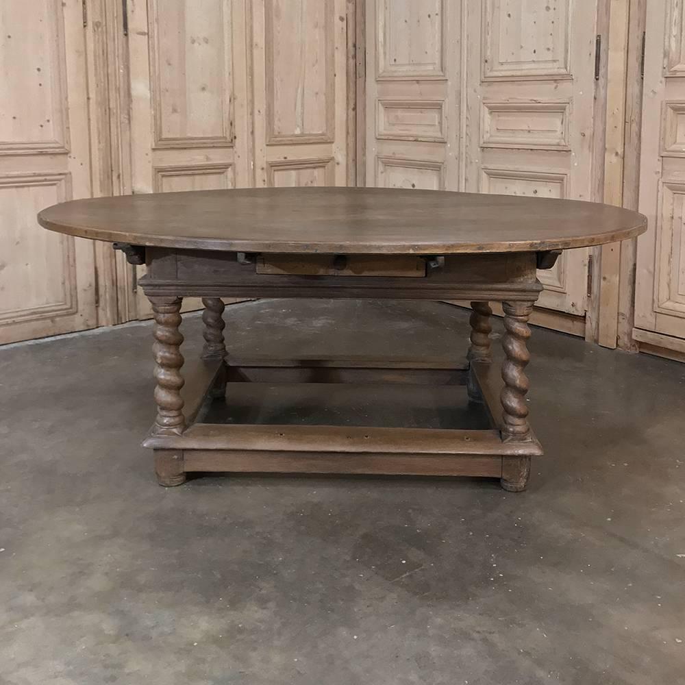 18th century French barley twist oval table makes a great choice as a rustic table, a breakfast table, or even a library table! Bold clockwise and counter-clockwise barley twist legs connect to the molded apron under the oval top, which comfortably