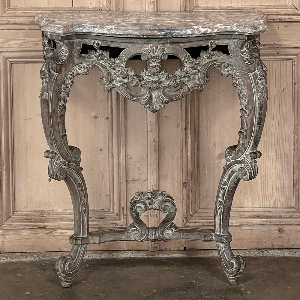 19th century French Baroque Marble Top Console with Ceruse Finish is a remarkable feat of wood sculpting! Using solid timbers and planks of sturdy oak, the artists created a serpentine form with bowed main apron pierce-carved through revealing a