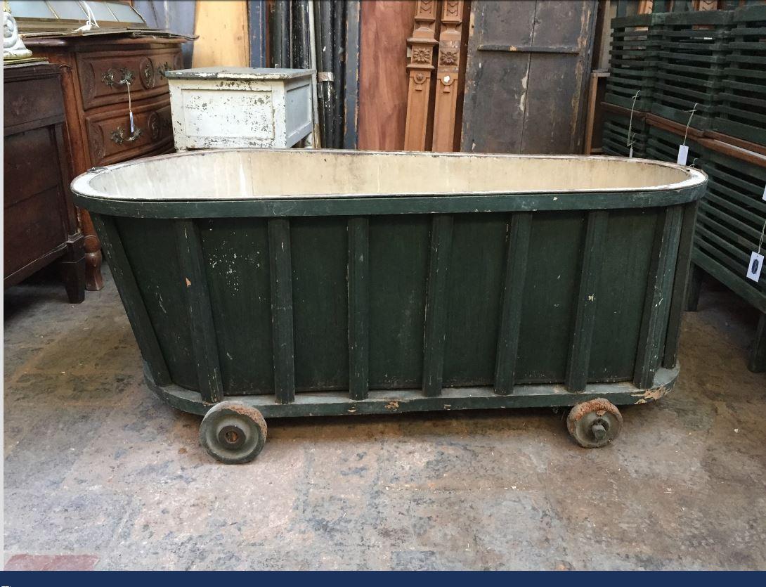 19th century French bath tub covered with green painted wood panel, 1890s.