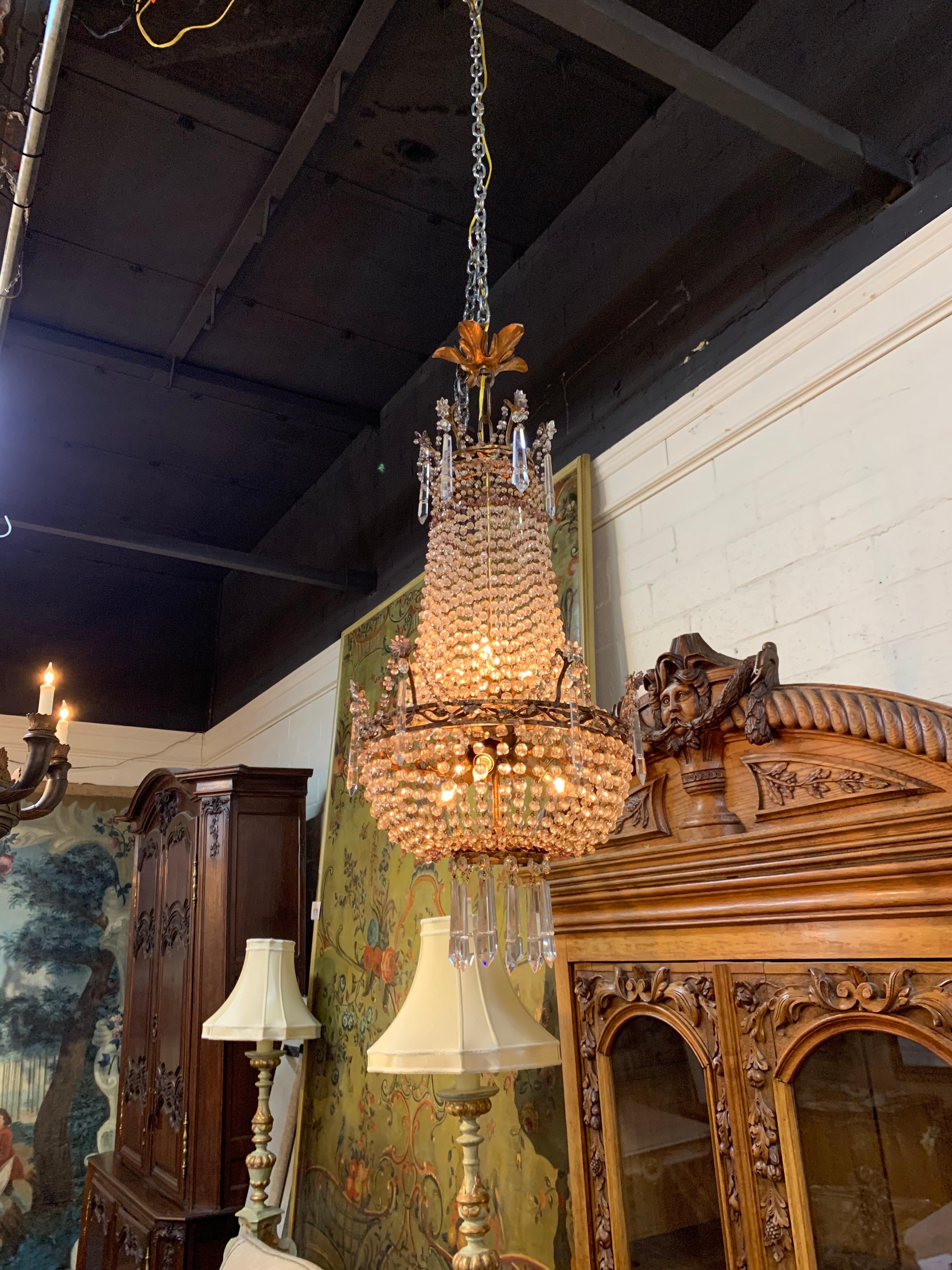 Elegant 19th century French beaded crystal and amethyst chandelier. Beautiful crystals mixed with touches of amethyst. Creates an impressive image!