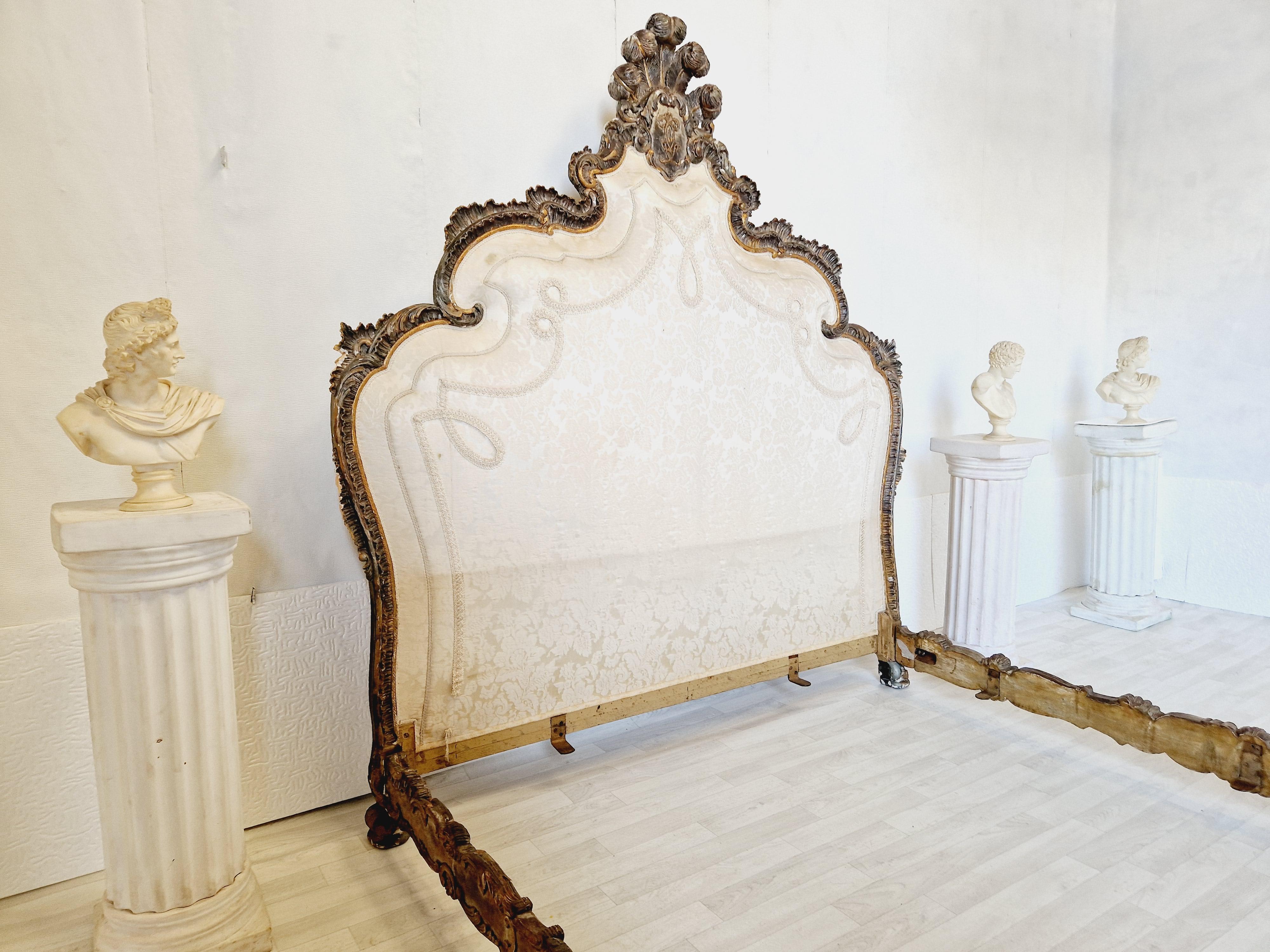 
Introducing a rare and exquisite 19th century Venetian bed of king size from Italy. This beautifully crafted bed is made of gilded wood material with intricate carvings, which adds character and elegance to any bedroom. It comes in a rectangular