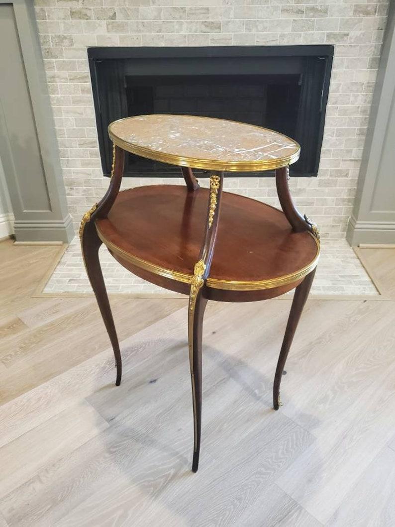 A lovely and important French Belle Epoch period two-tier dessert table from legendary American businessman, T. Boone Pickens Preston Hollow, North Dallas home. Hand-crafted from rich mahogany in the late 19th century, exceptionally executed in