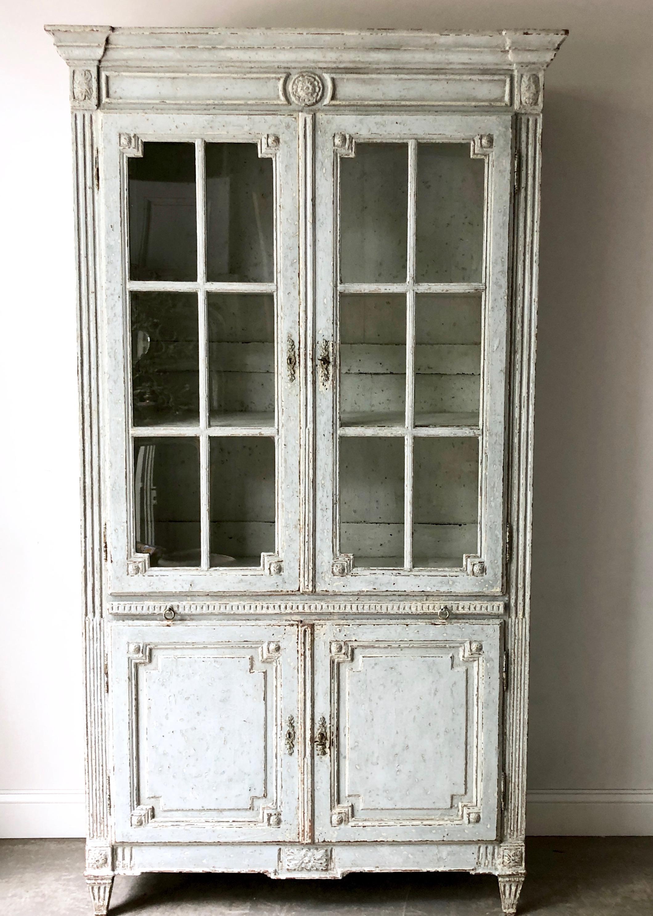 19th century French Bibliotheque / library cabinet in Louis XVI style with ritchy carved glazed doors, pull-out self and reeded corner posts with flower medallion blocks on fluted carved tapered feet.
Here are few examples… Surprising pieces and