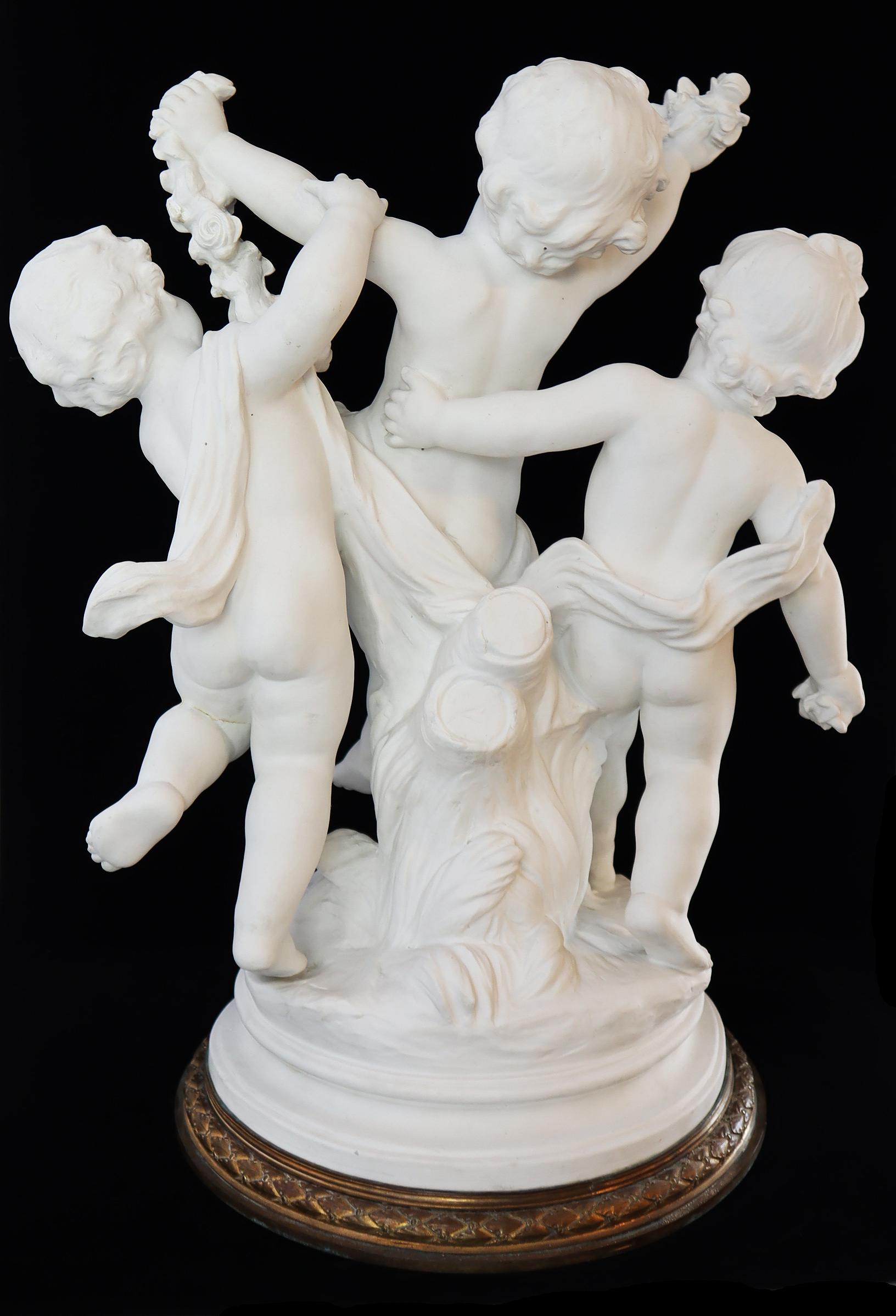 A statue of three cherubs
bisque, French, 19th century Signed on lower right. (