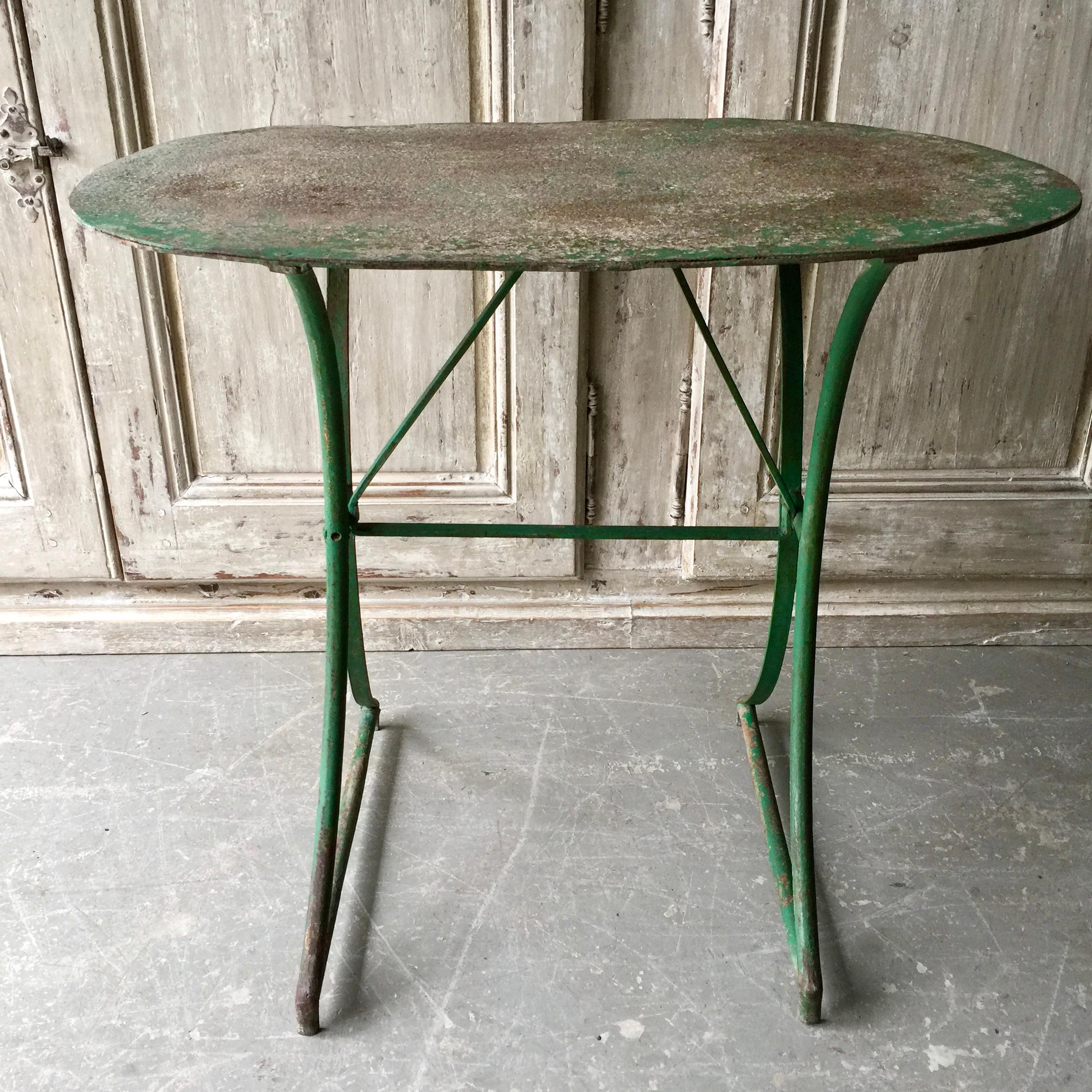 Charming French 19th century oval double pedestal base Bistro table in original worn rustic patina.

   