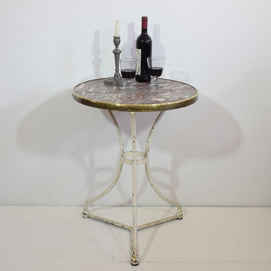 Great metal bistro table with a beautiful weathered red marble top. Rare period piece
France, circa 1850-1900
Weathered and some natural hairlines in the marble.