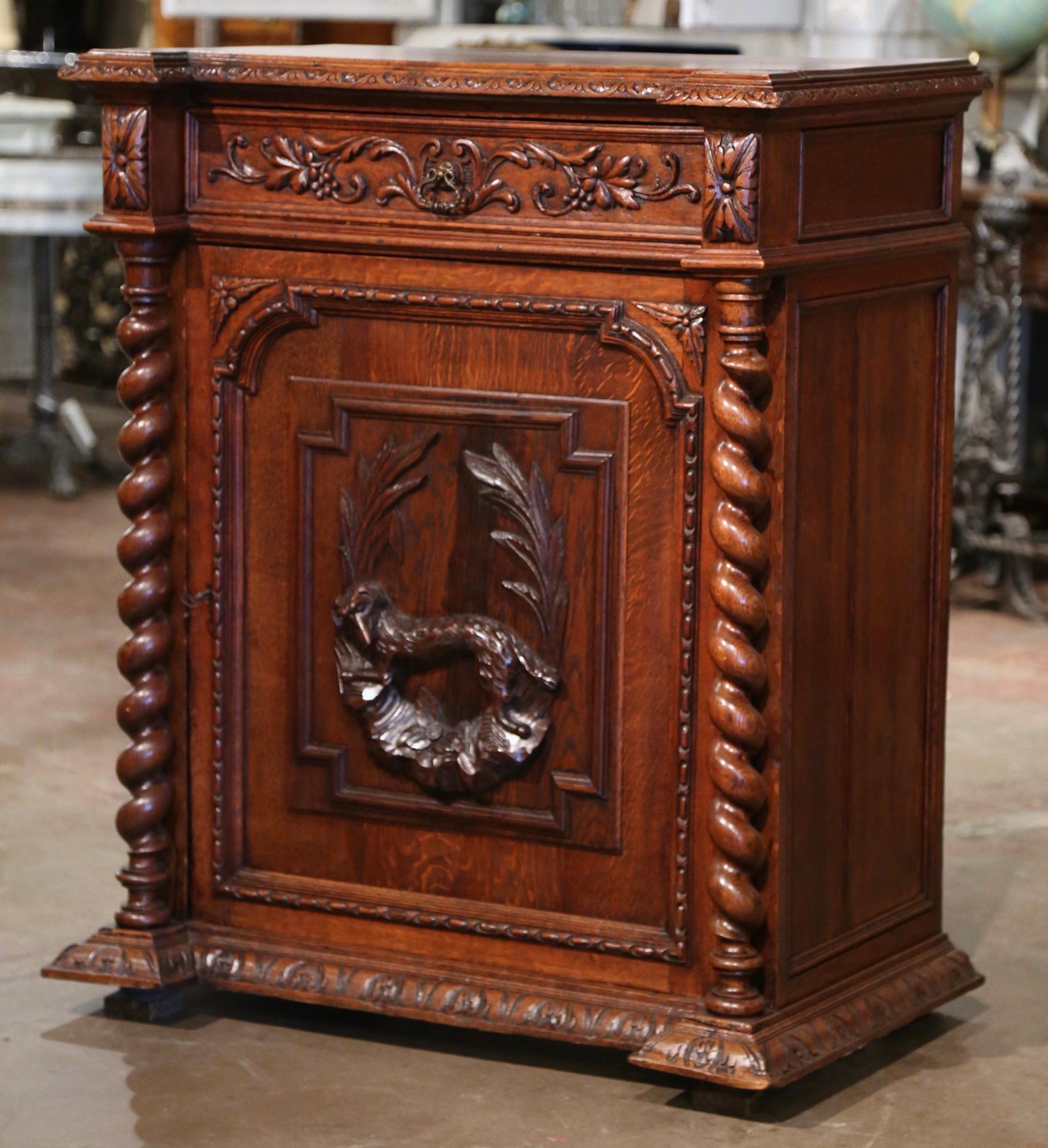 Decorate a ranch house or hunting lodge with this elegant antique Black Forest cabinet. Crafted in France, circa 1870, the jelly cabinet stands on a recessed molded plinth base over square feet. The 