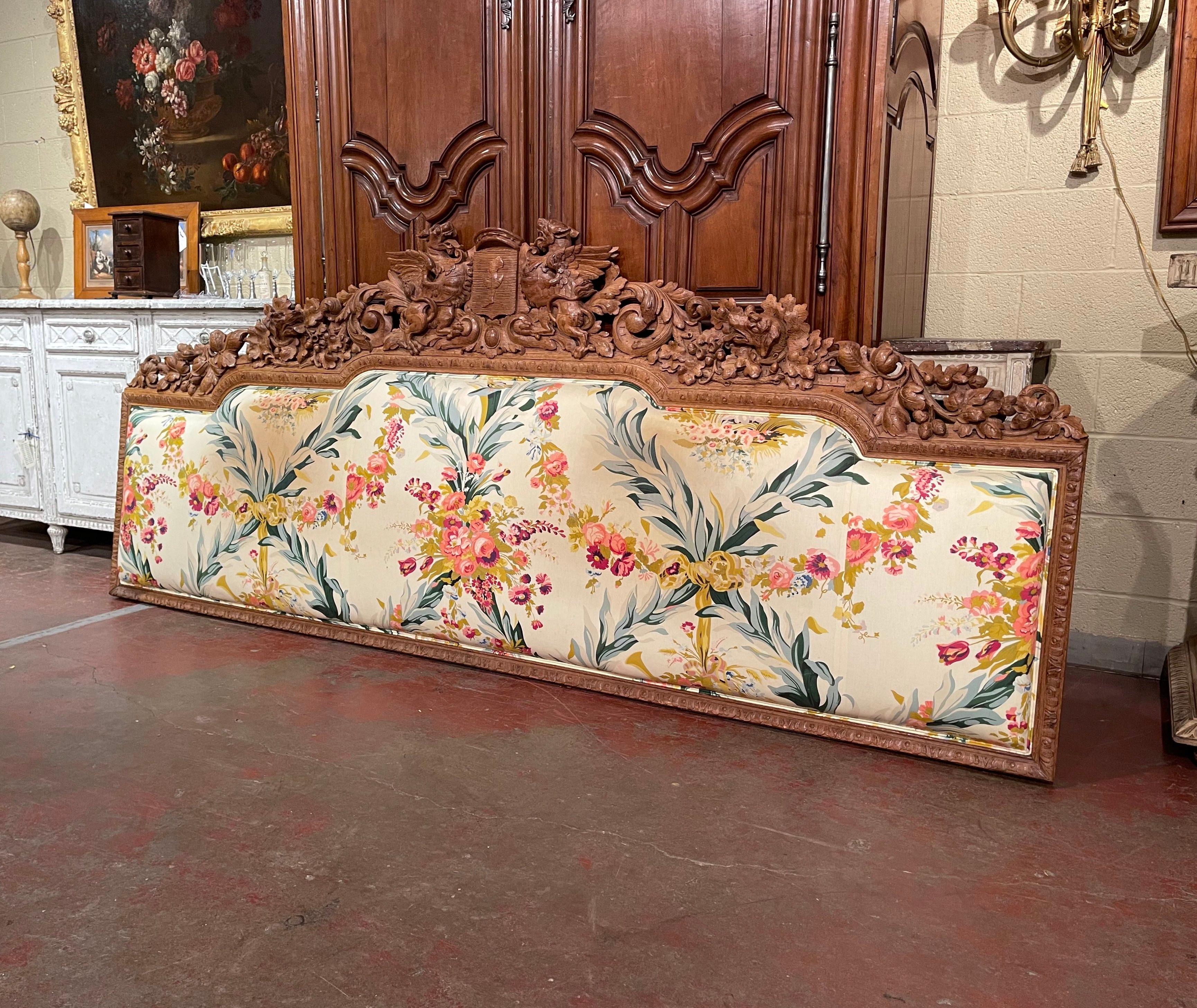 Decorate a master bedroom with this exquisite black forest headboard. Crafted in France circa 1860 and made of oak, the Gothic style wall hanging frame features heavily carvings throughout including hand carved acorn, acanthus leaf, and dog head