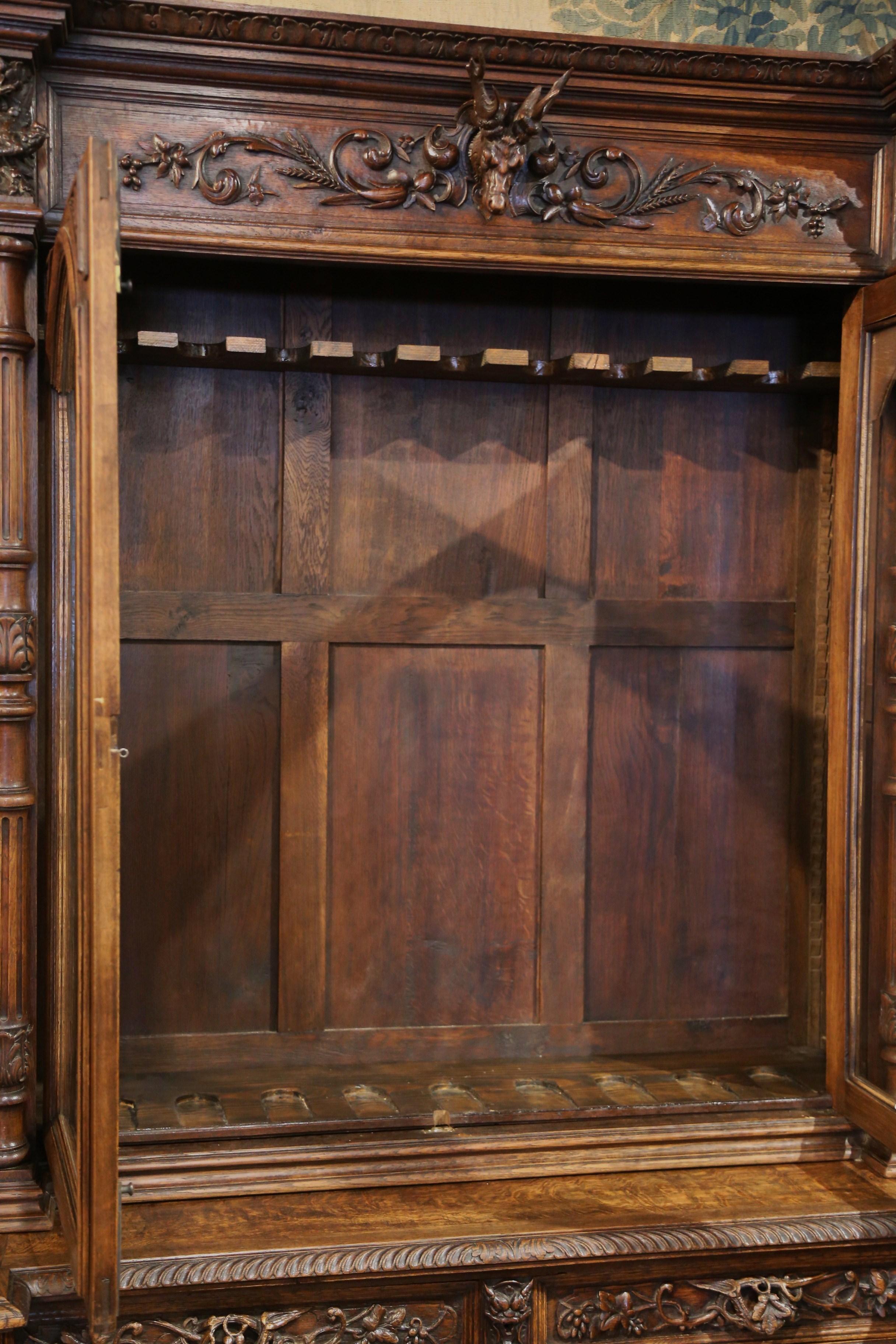 19th Century French Black Forest Carved Oak Nine-Gun Cabinet with Hunt Motifs 6
