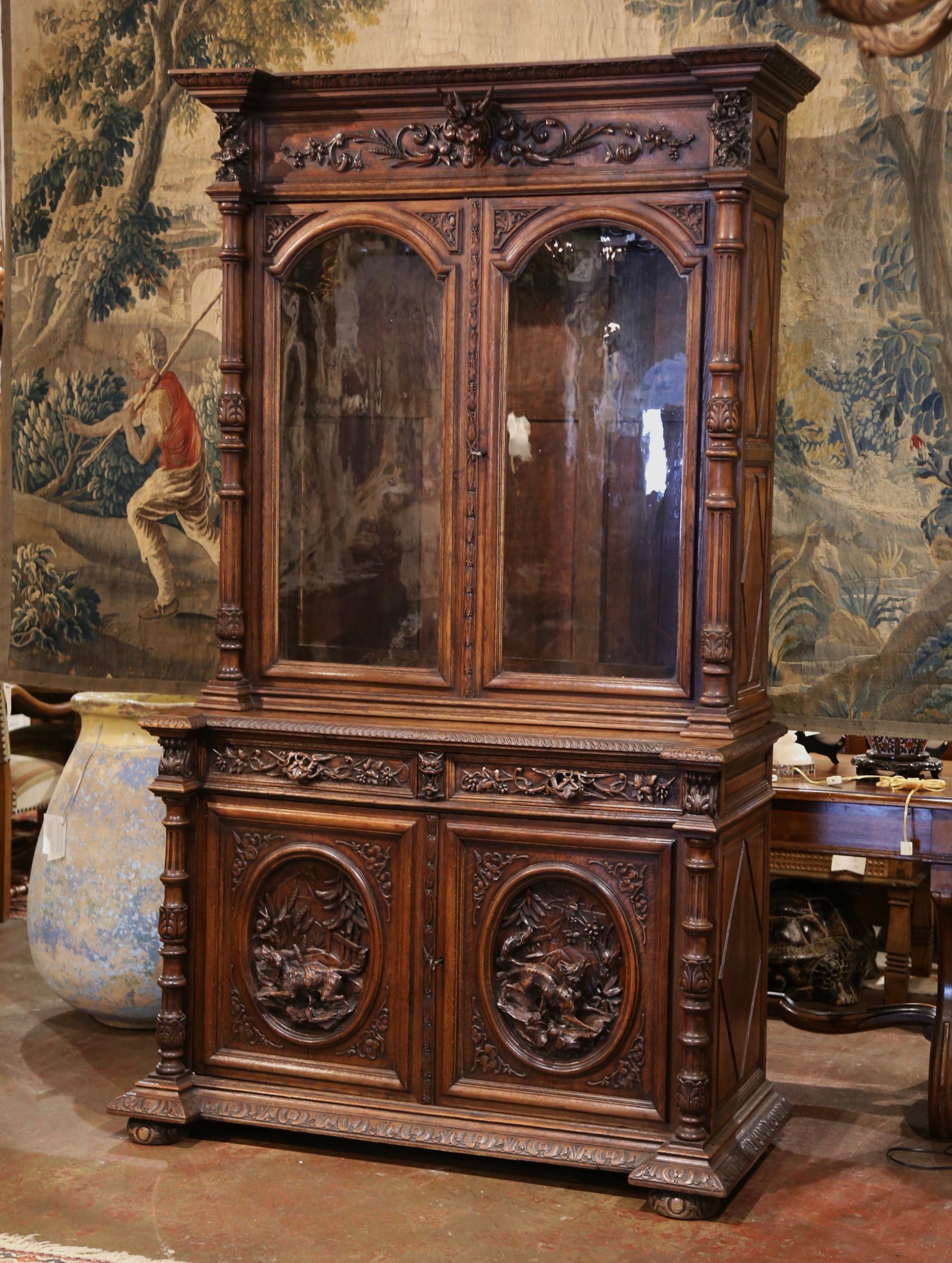 Hand-Carved 19th Century French Black Forest Carved Oak Nine-Gun Cabinet with Hunt Motifs