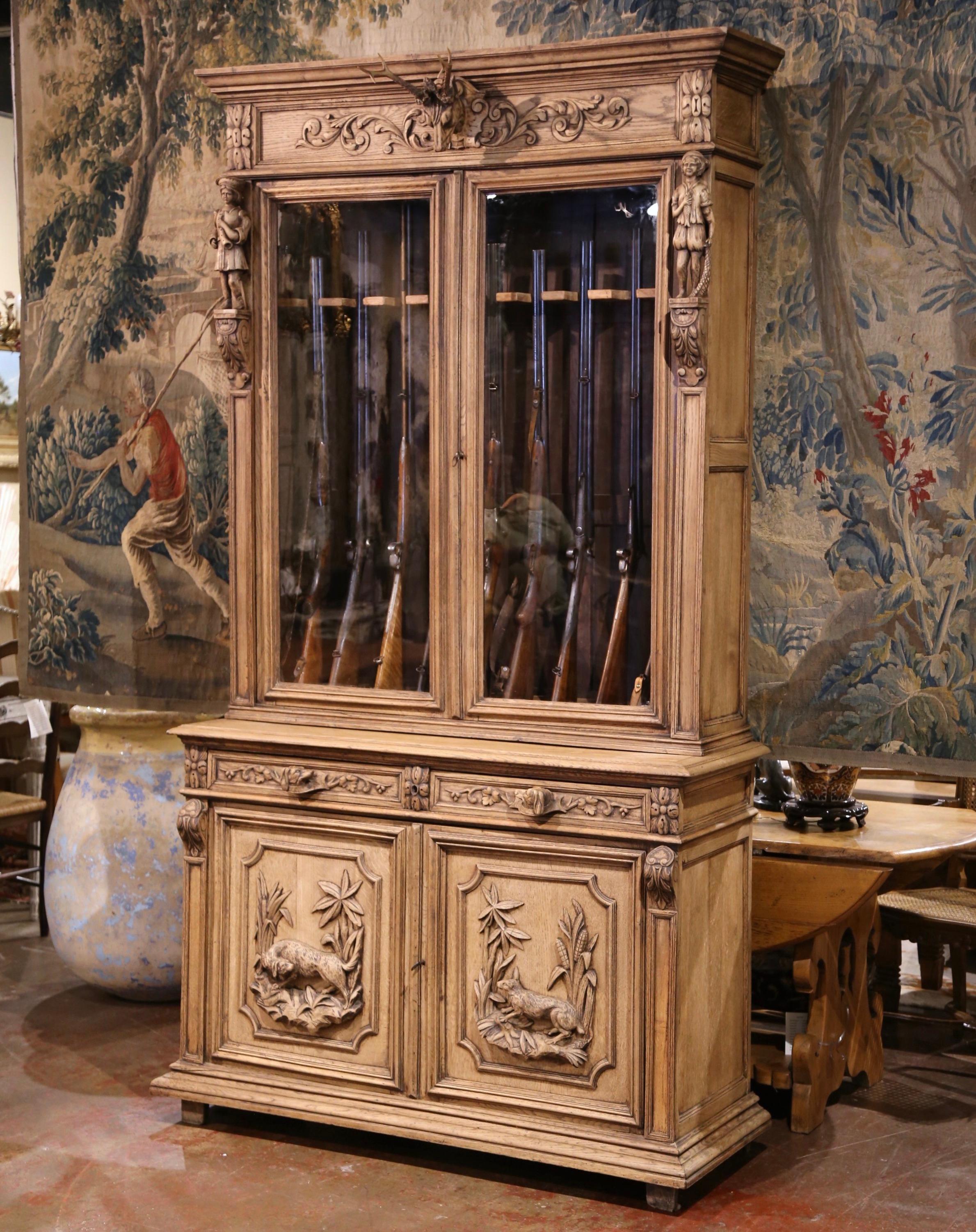 Glass 19th Century French Black Forest Carved Oak Nine-Gun Cabinet with Hunt Motifs