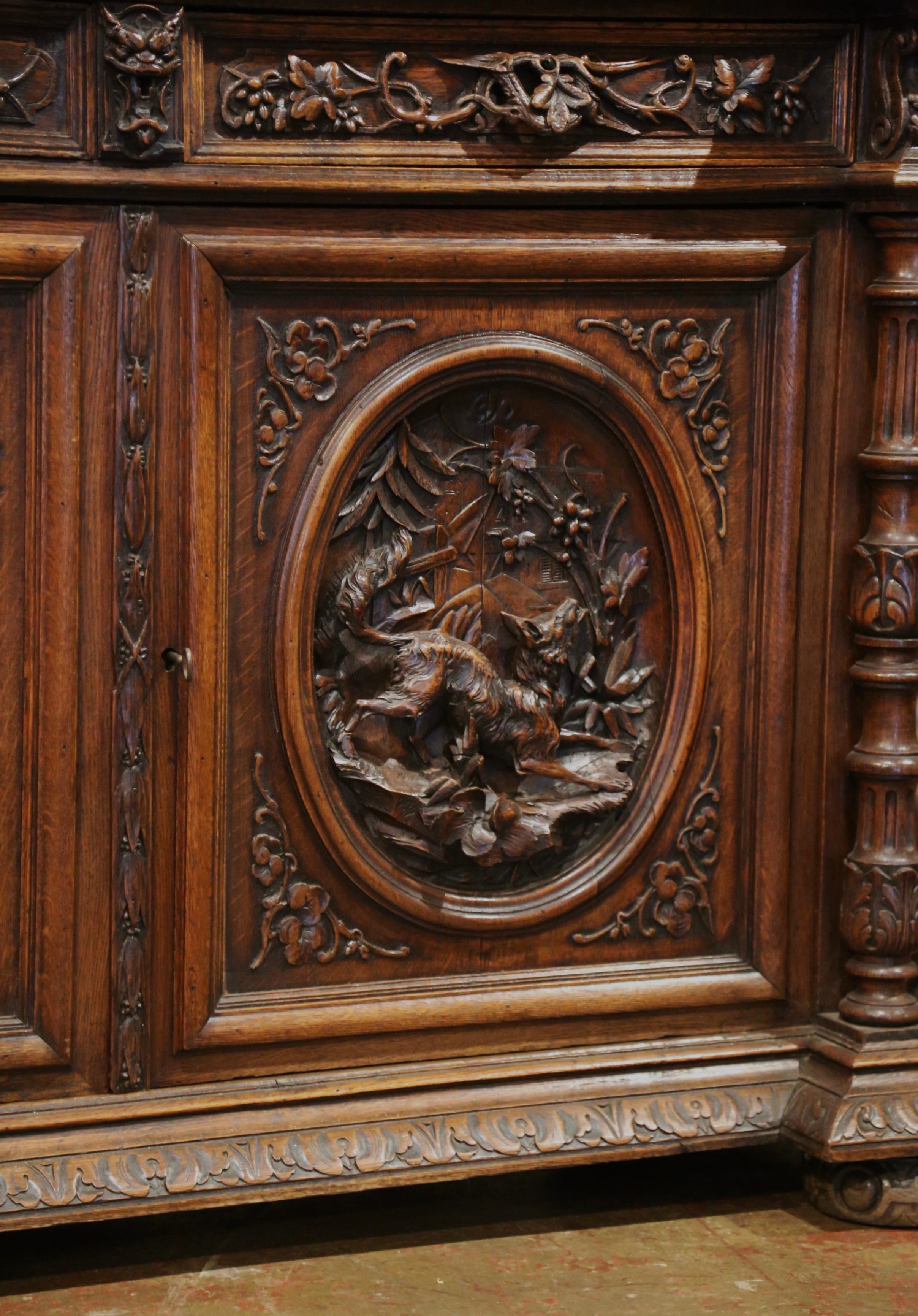 Glass 19th Century French Black Forest Carved Oak Nine-Gun Cabinet with Hunt Motifs