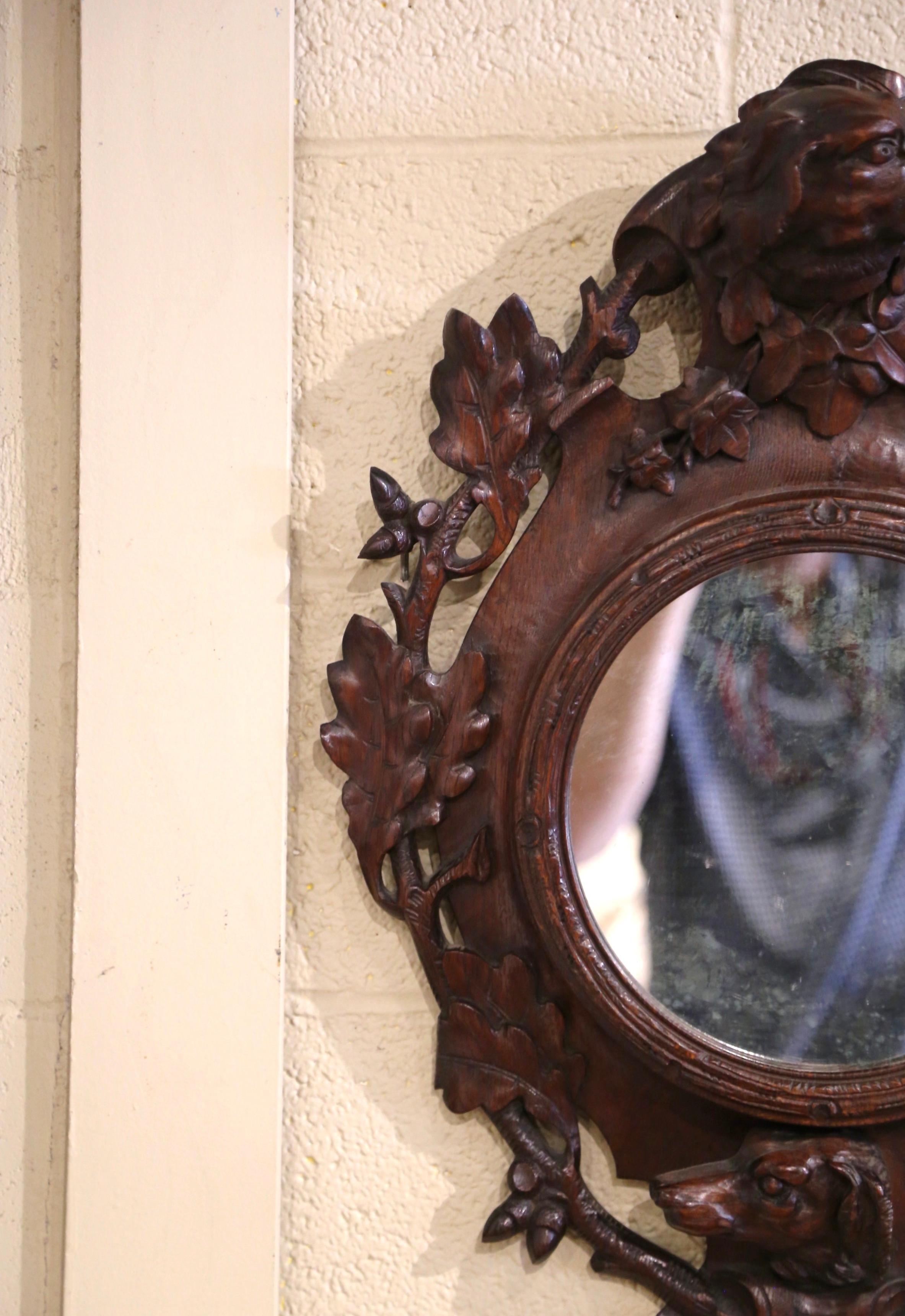 Patinated 19th Century French Black Forest Carved Oak Wall Mirror with Dog and Leaf Motifs