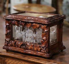 19th Century French Black Forest Carved Walnut Tantalus with Crystal Decanters