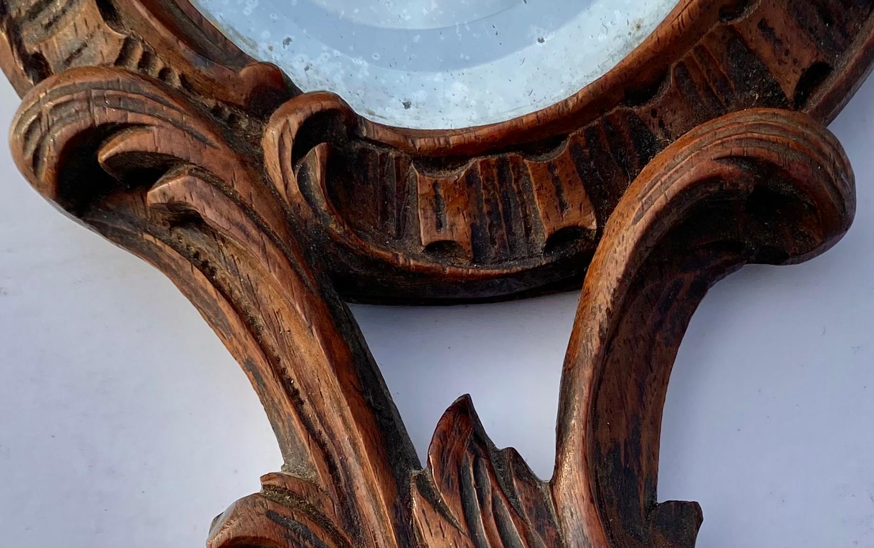 19th Century French Black Forest Carved Walnut Hand Mirror with Beveled Glass In Good Condition In New Orleans, LA