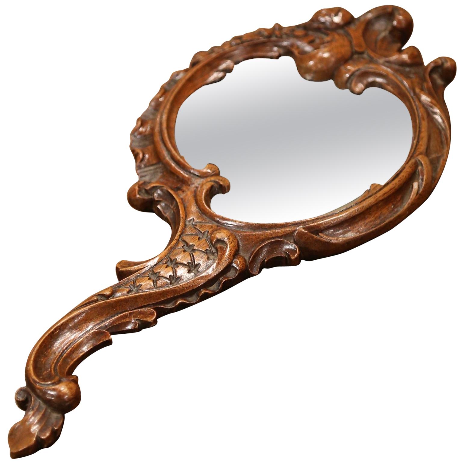 19th Century French Black Forest Carved Walnut Hand Mirror with Beveled Glass