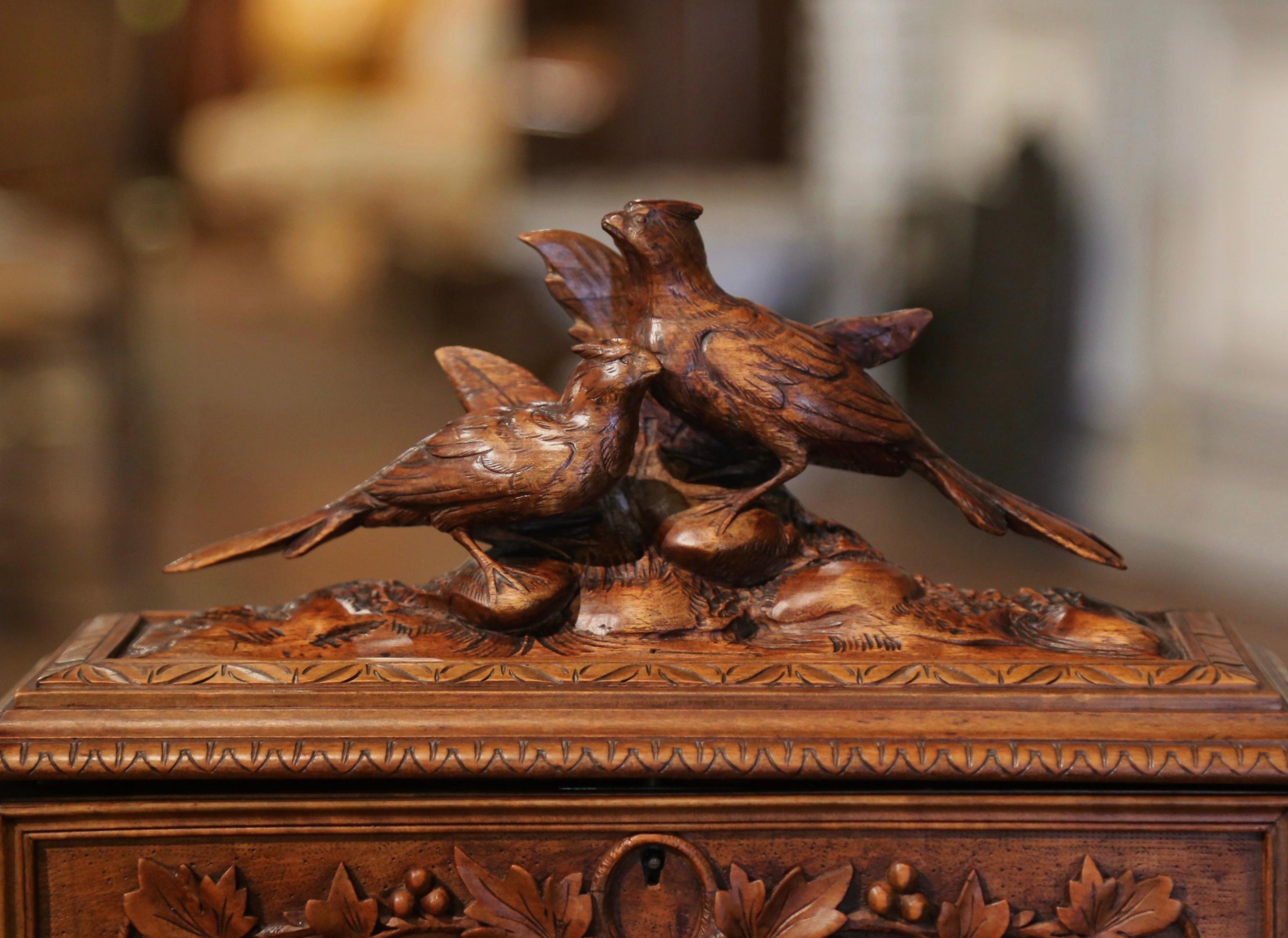 Place your jewelry and small valuable treasures in this beautifully carved decorative box. Carved of walnut wood in France circa 1880, the black forest box sits on small bracket feet and features high quality carving decor, including two hand carved