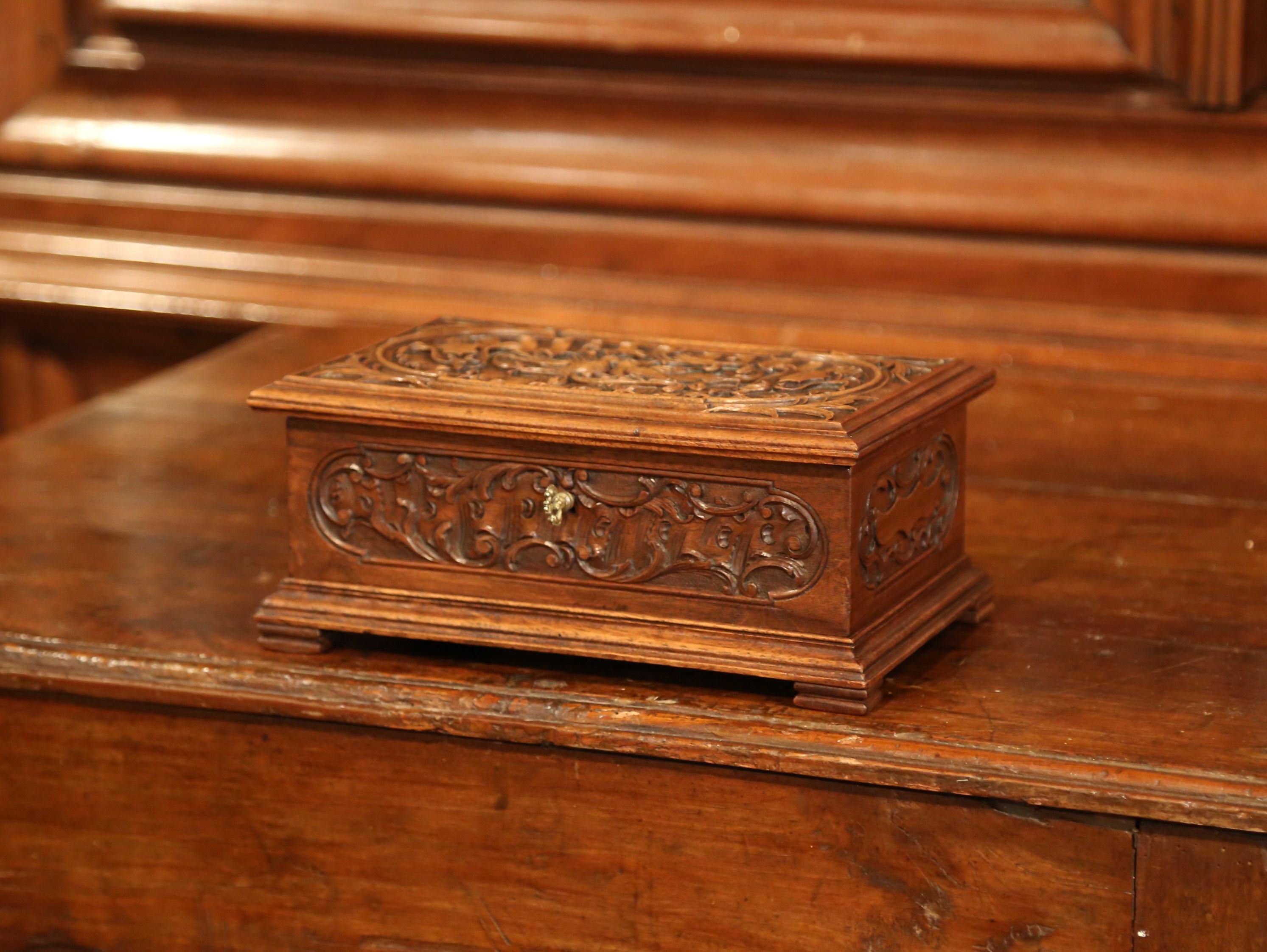 Place your jewelry and small valuable treasures in this beautifully carved decorative box. Created in France circa 1870, the wedding box features high quality carving decor, including a center medallion shell decorated with love birds and foliage.