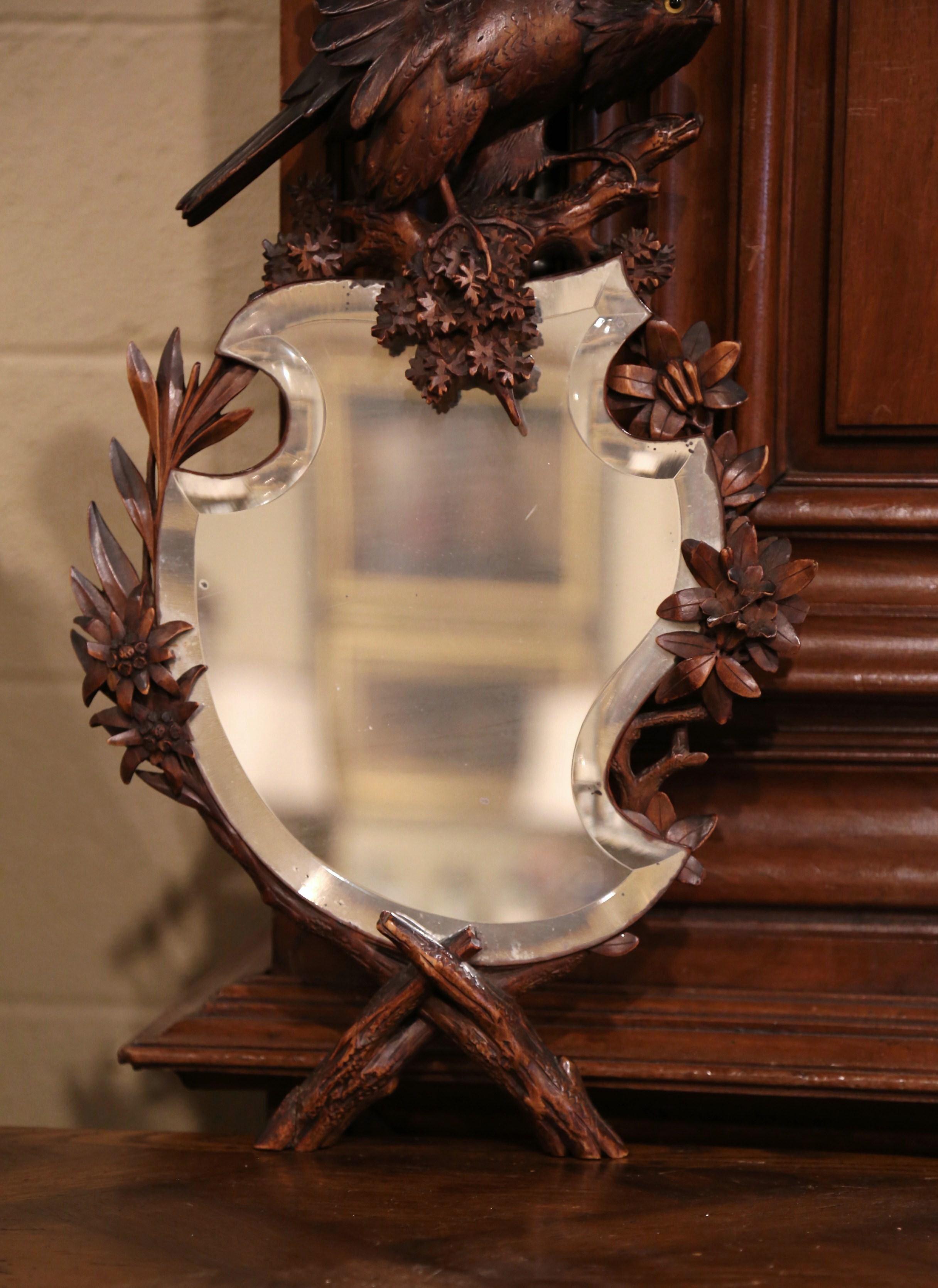 Beveled 19th Century French Black Forest Carved Walnut Mirror with Eagle Sculpture