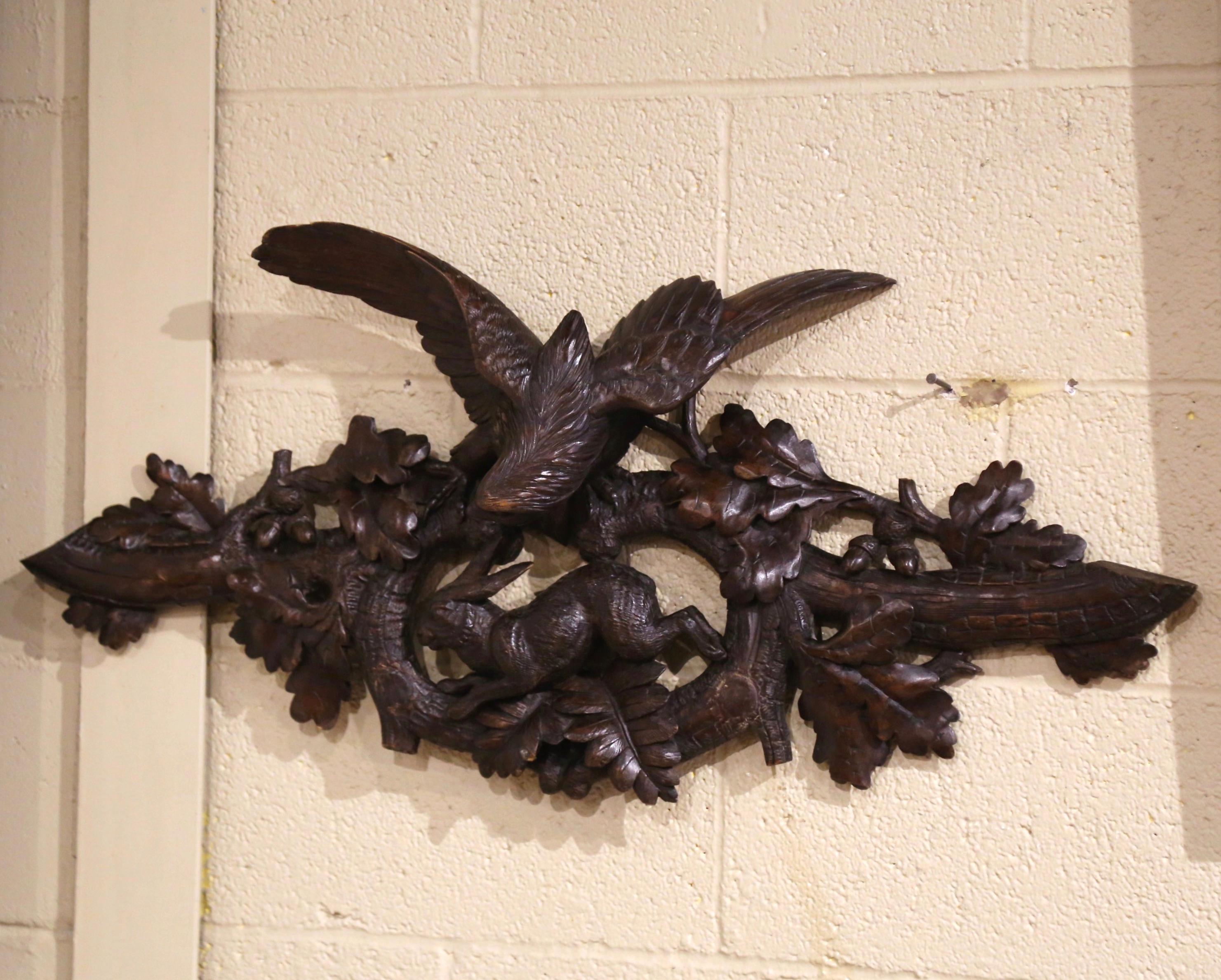 Place this elegant wall hanging decor in a bar area, wine cellar, or above a door in your home or cabin. Created in France, circa 1880, the fruitwood hunting scene features high quality carving, including an eagle with wings extended over a running