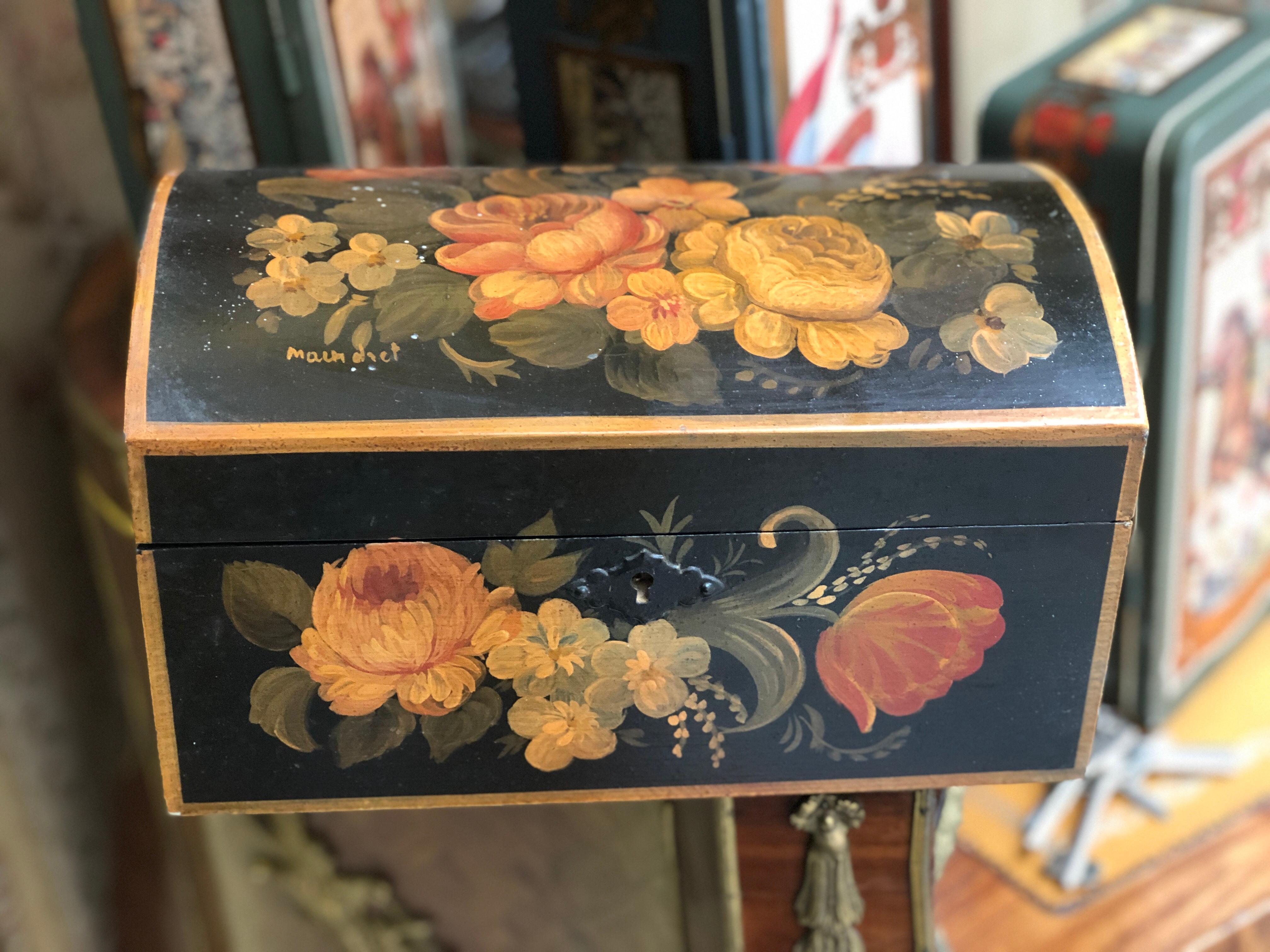 Beautiful hand painted box decorated with flowers and leaves in red and yellow on black base. Very good condition, signed on the top.
France, circa 1890.
 
